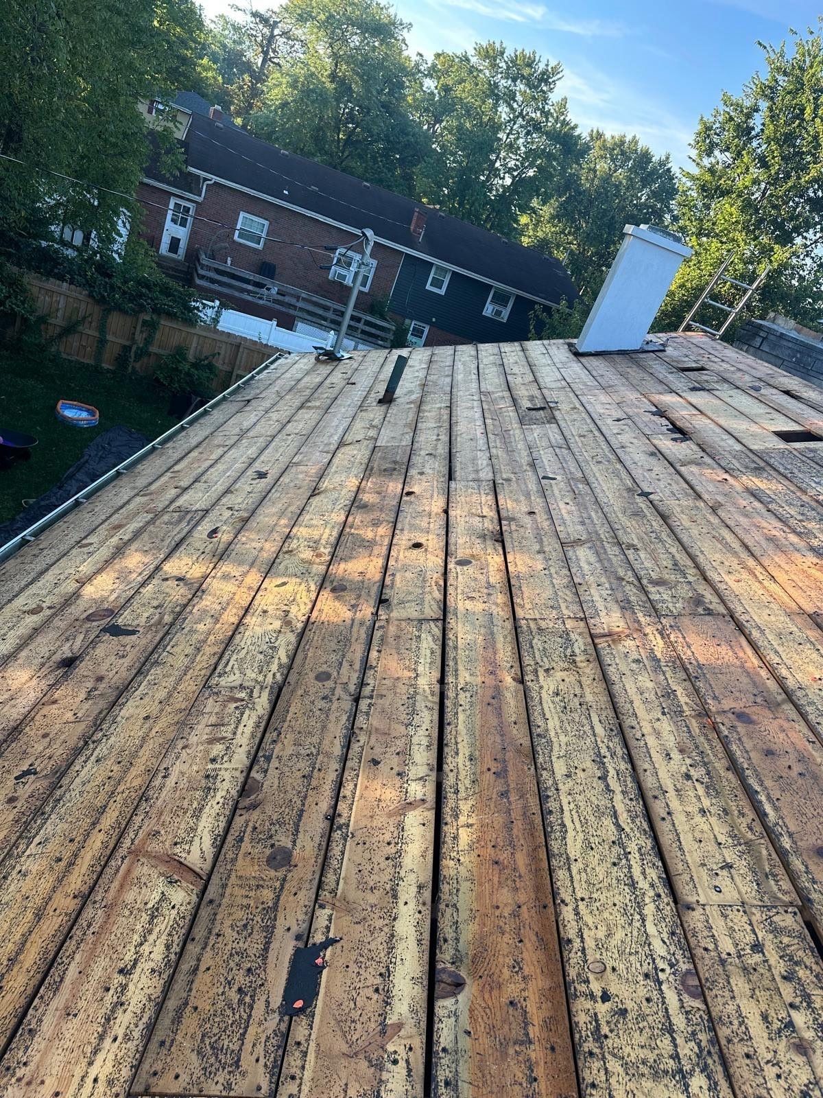 The board deck after tear-off, looking toward the white chimney chase, Fairborn, Ohio.