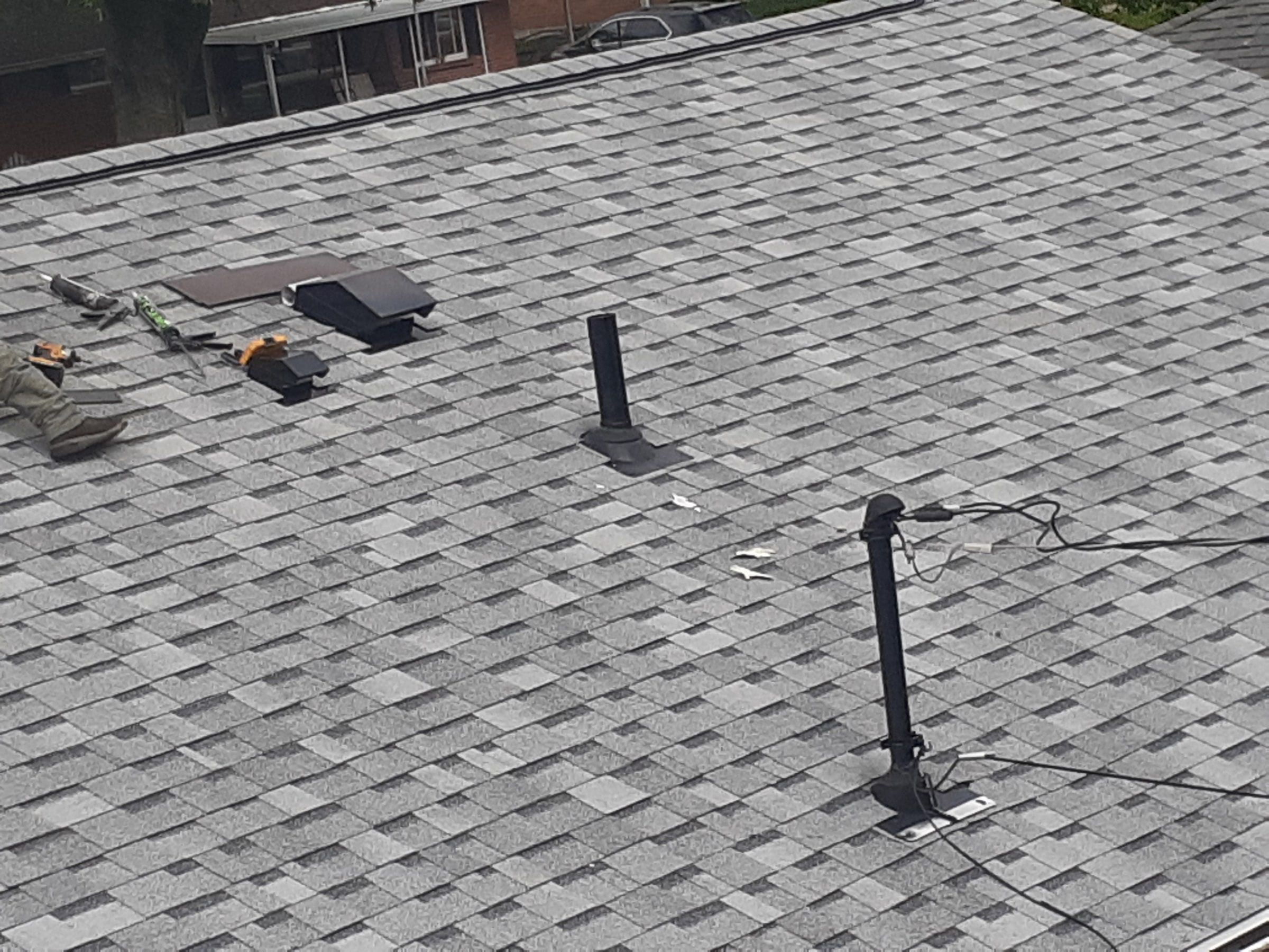 New vent pipes and roof vents on the finished slope, Huber Heights, Ohio.