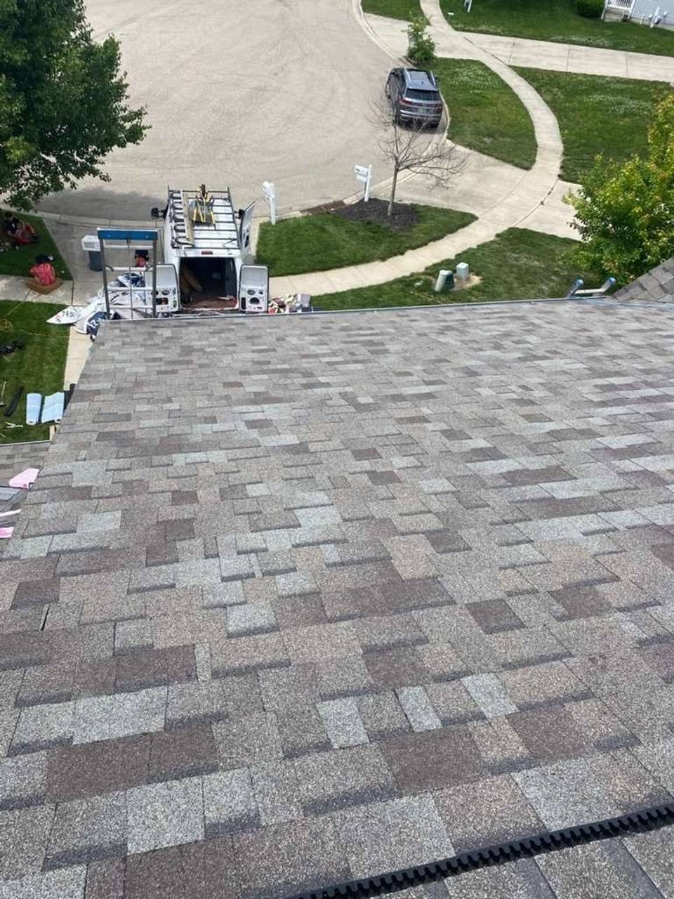 The finished storm damage roof replacement above the driveway, Beavercreek, Ohio.