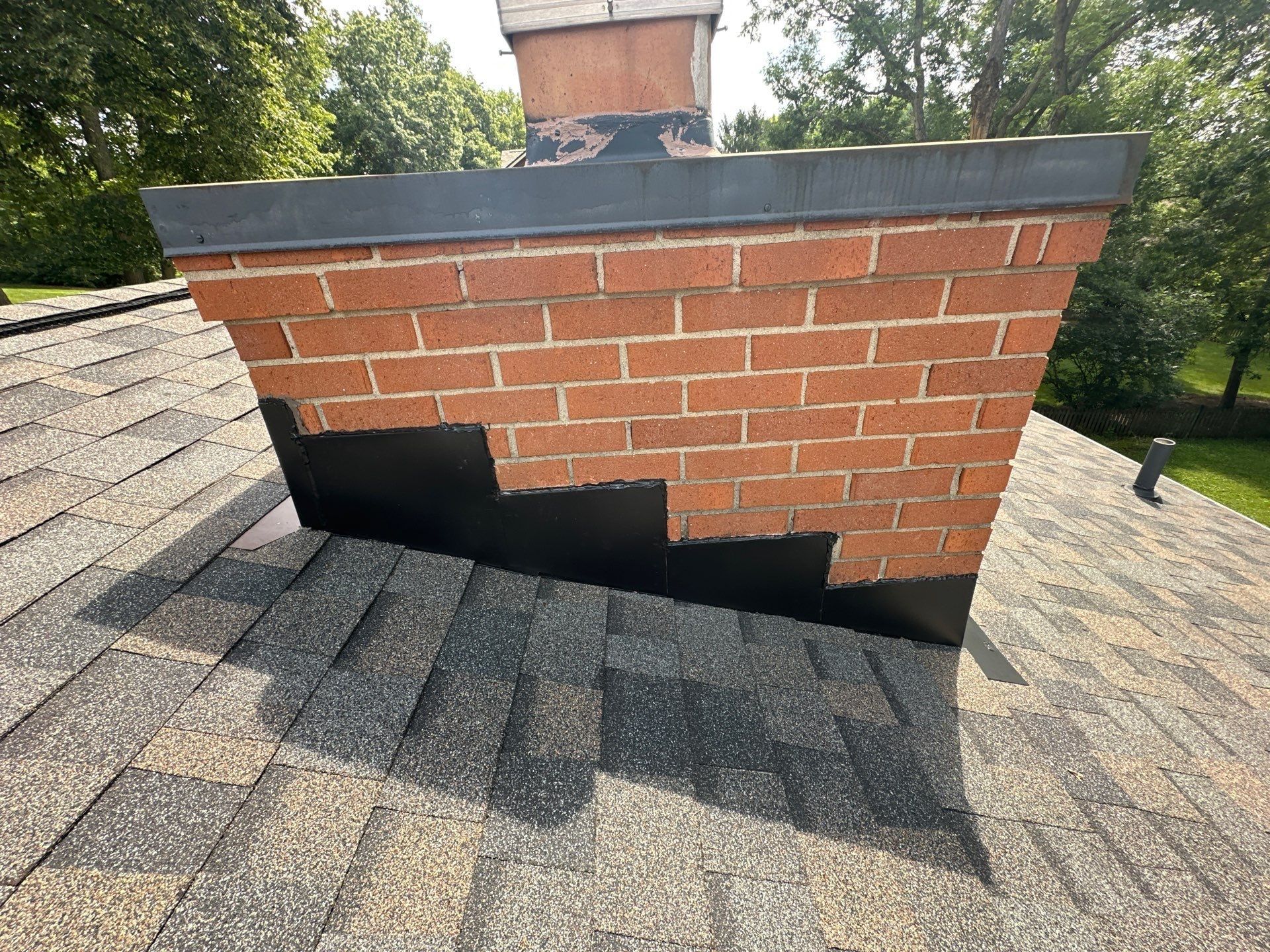 New flashing and cricket at the chimney
