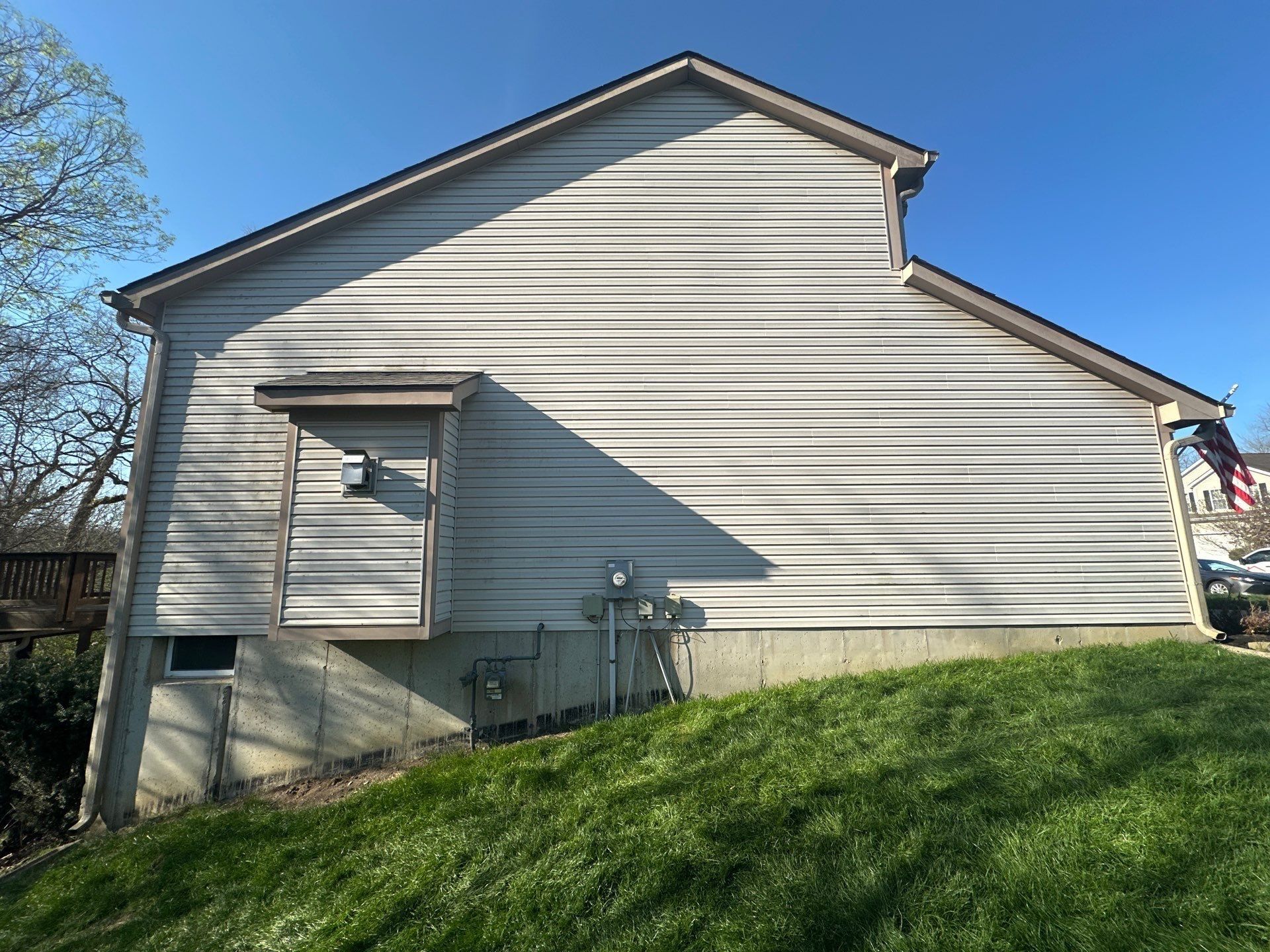 Gable end, meters and sloping lawn
