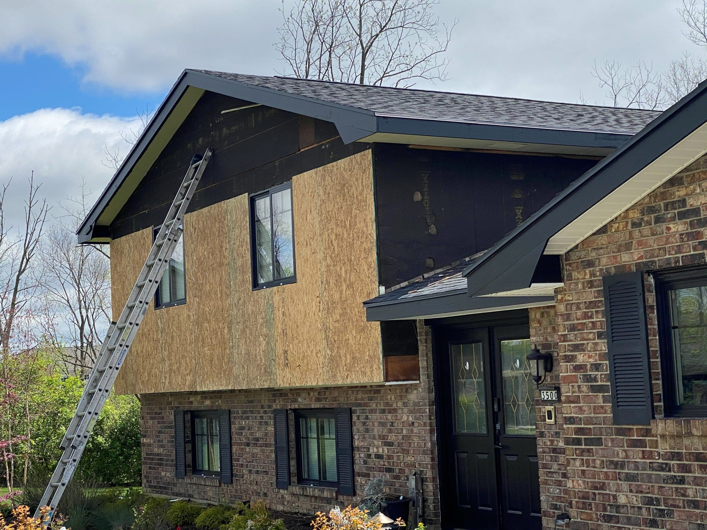 New OSB sheathing going up on the front of the upper story, Beavercreek, Ohio.