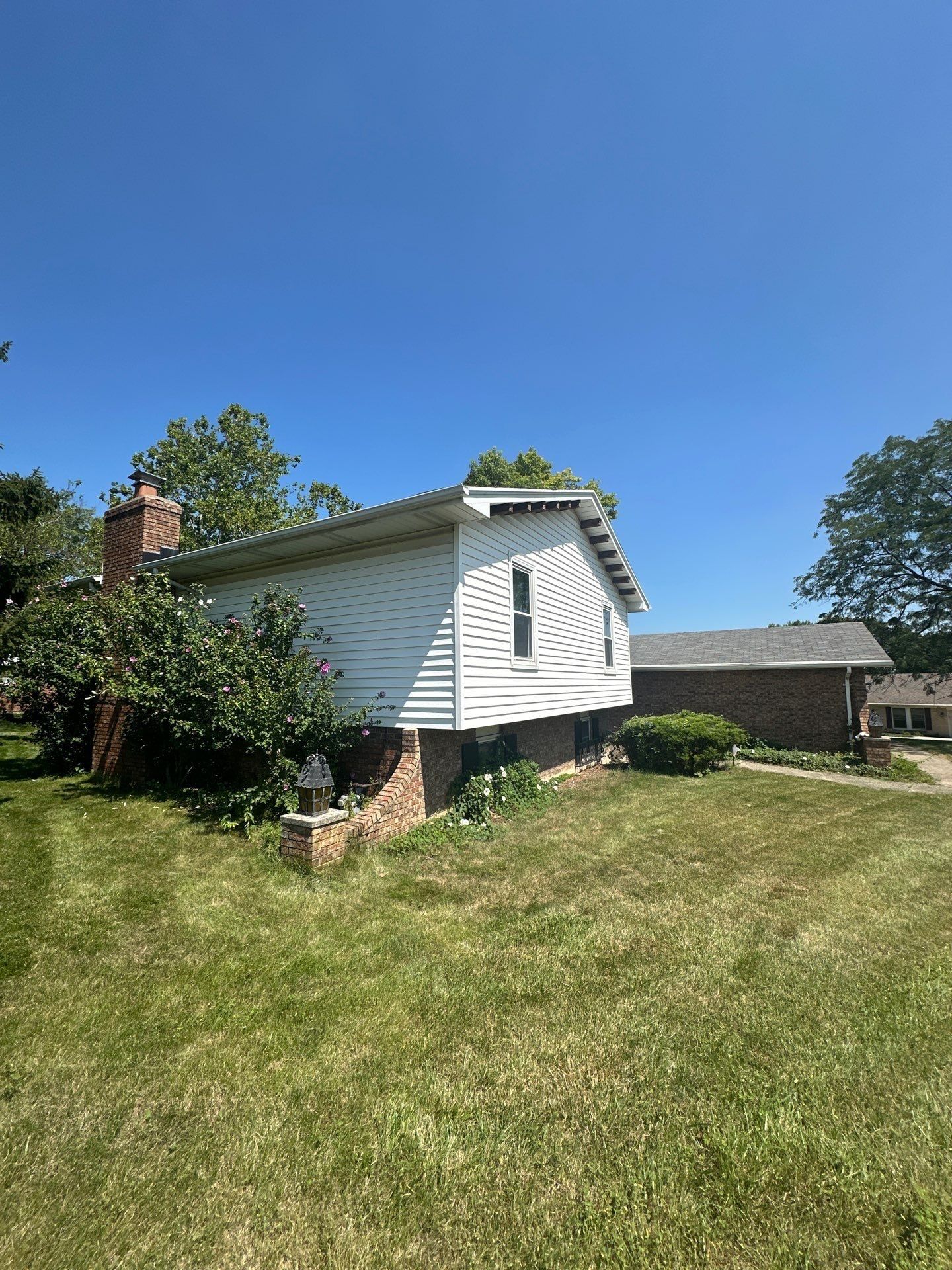 The two-story end of the house with its chimney, from the side yard, West Carrollton, Ohio.