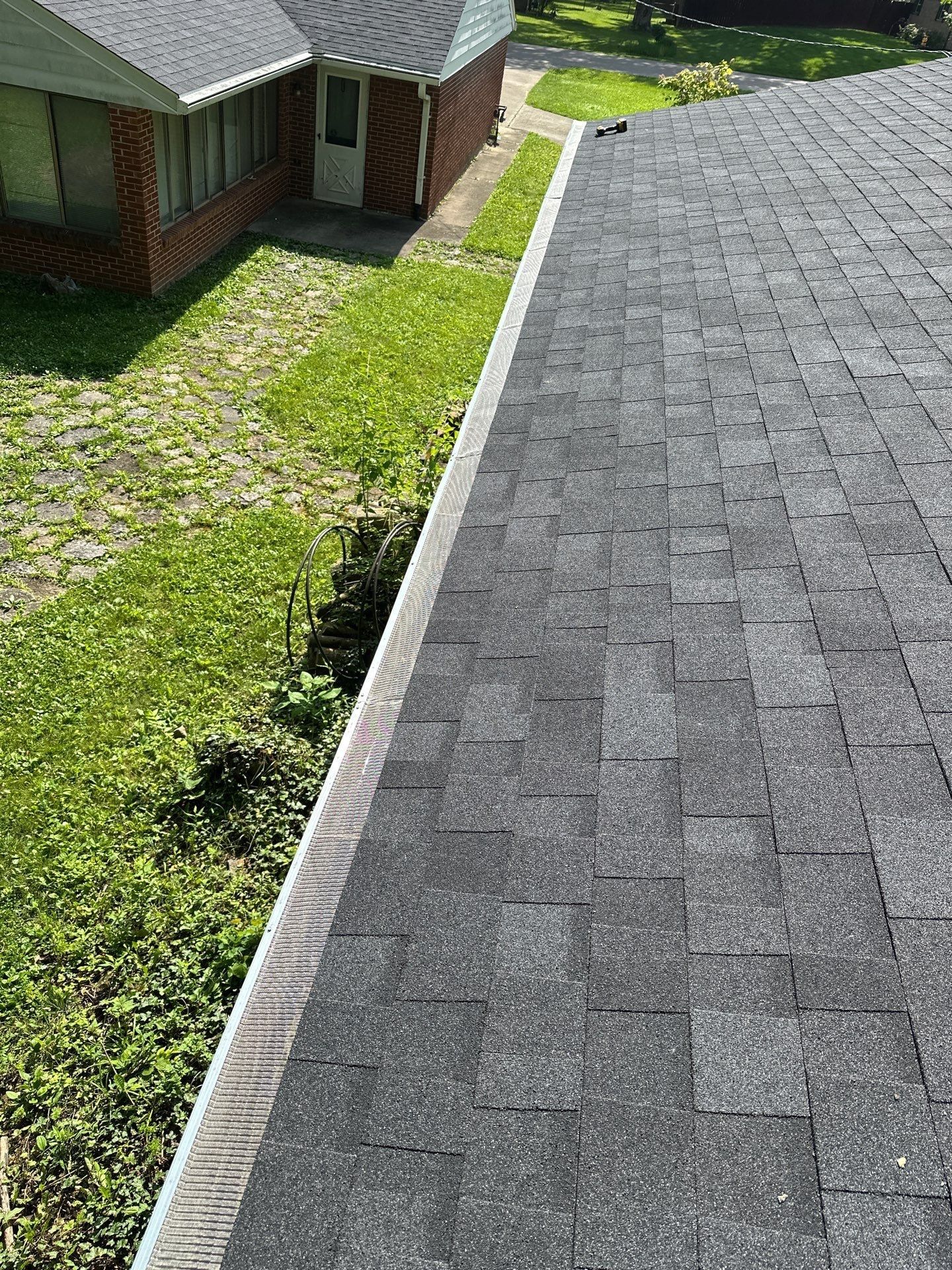 Gutter guards along the garage eave, seen from the roof, Beavercreek, Ohio.