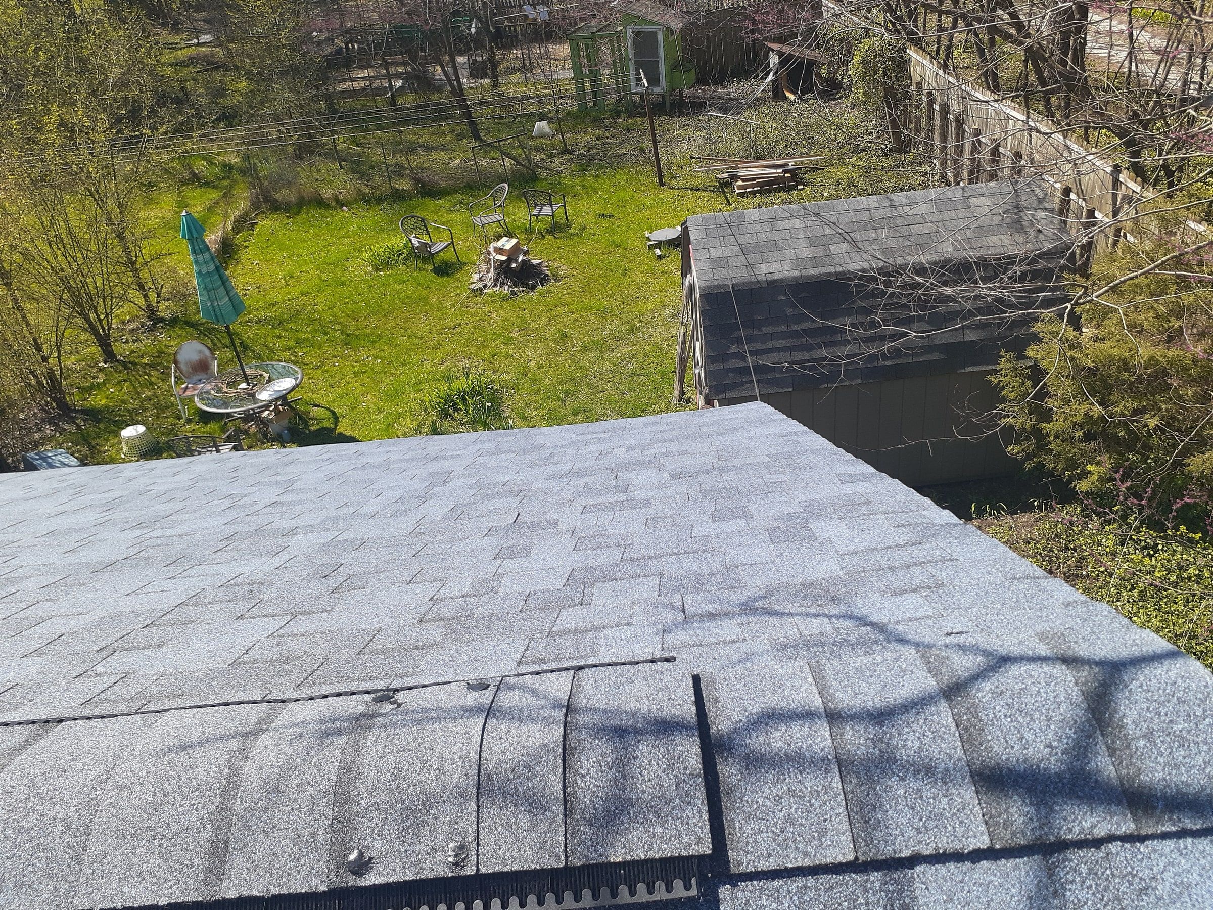 The finished end of the roof, with ridge cap over the ridge vent, Yellow Springs, Ohio.
