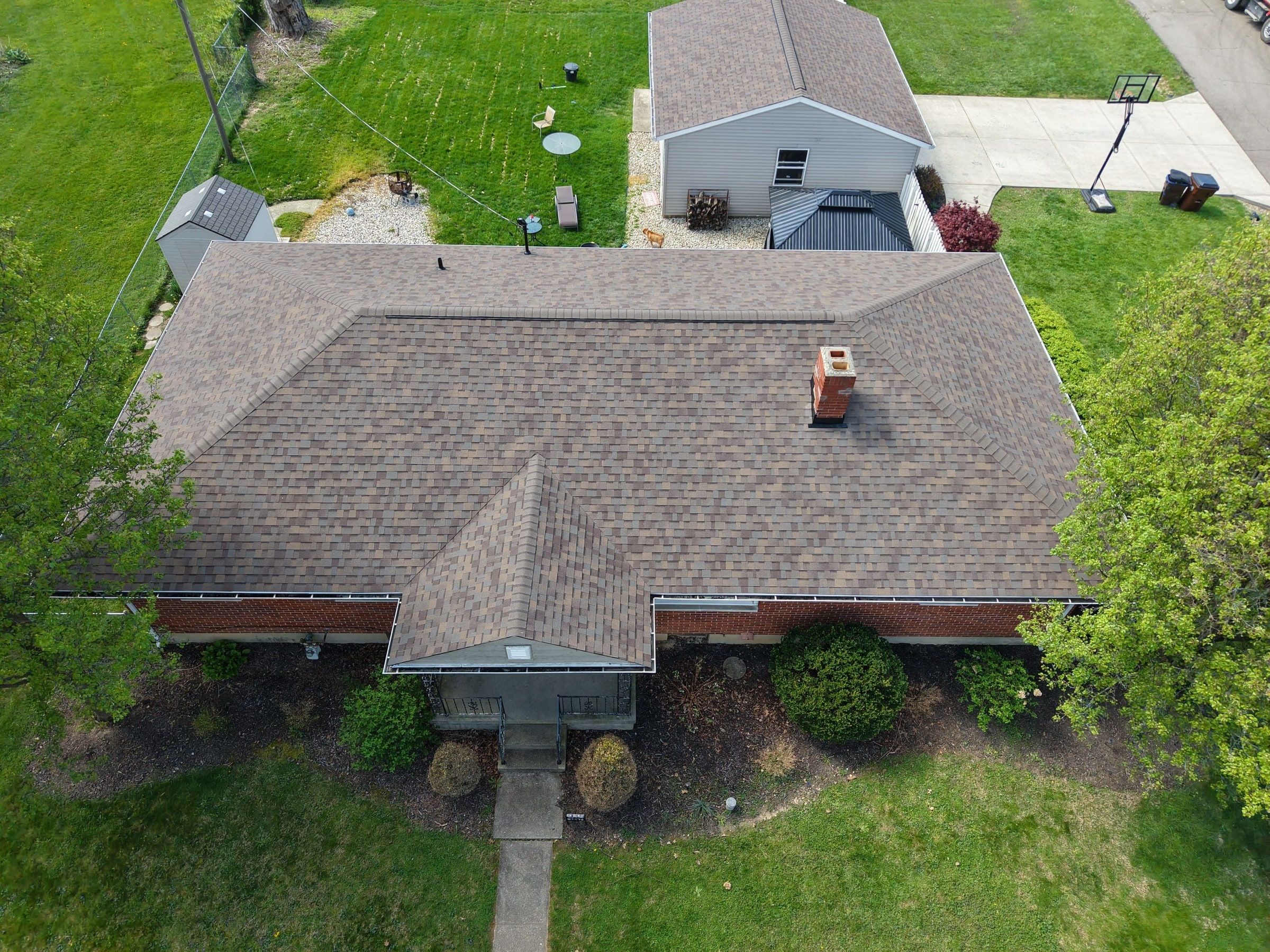 Drone view of the finished roof and sheathing replacement on the brick ranch, Beavercreek, Ohio.
