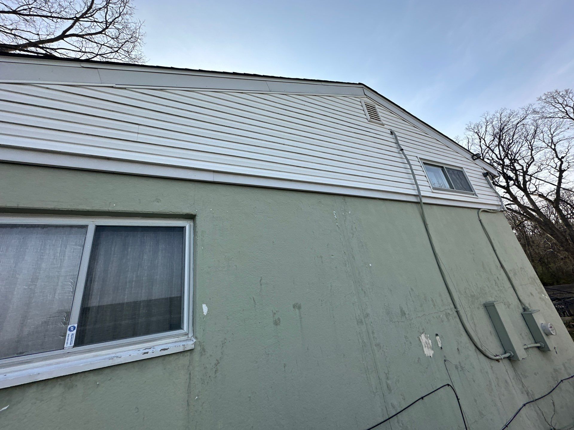 Gable plane above the mint-green wall