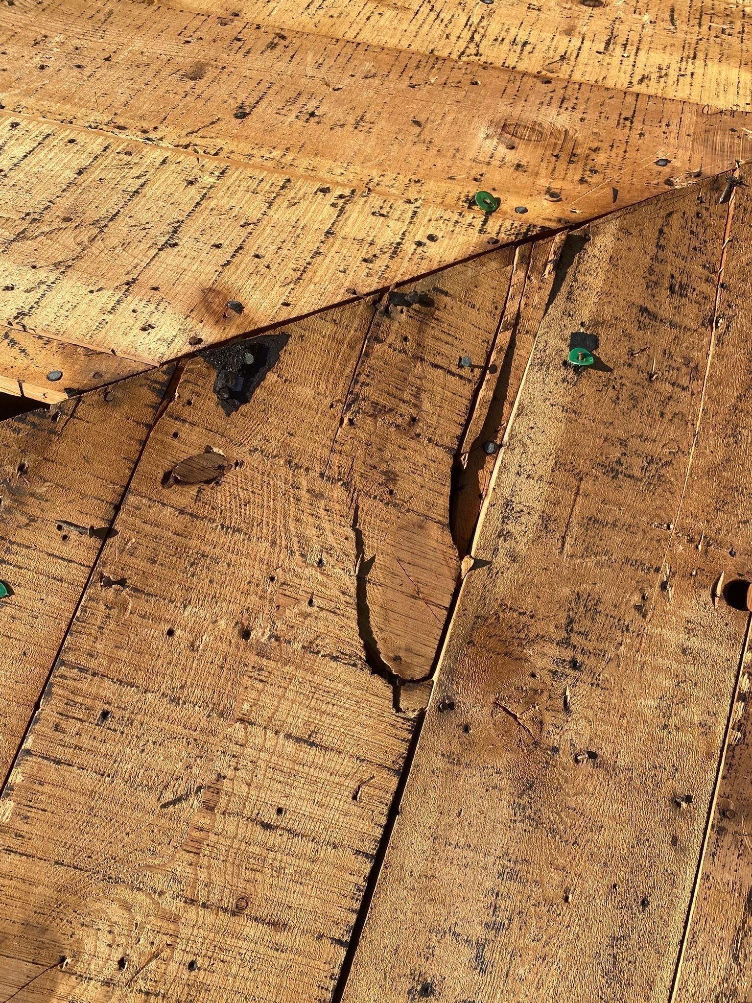 Broken deck board split open along the grain before replacement, Beavercreek, Ohio.