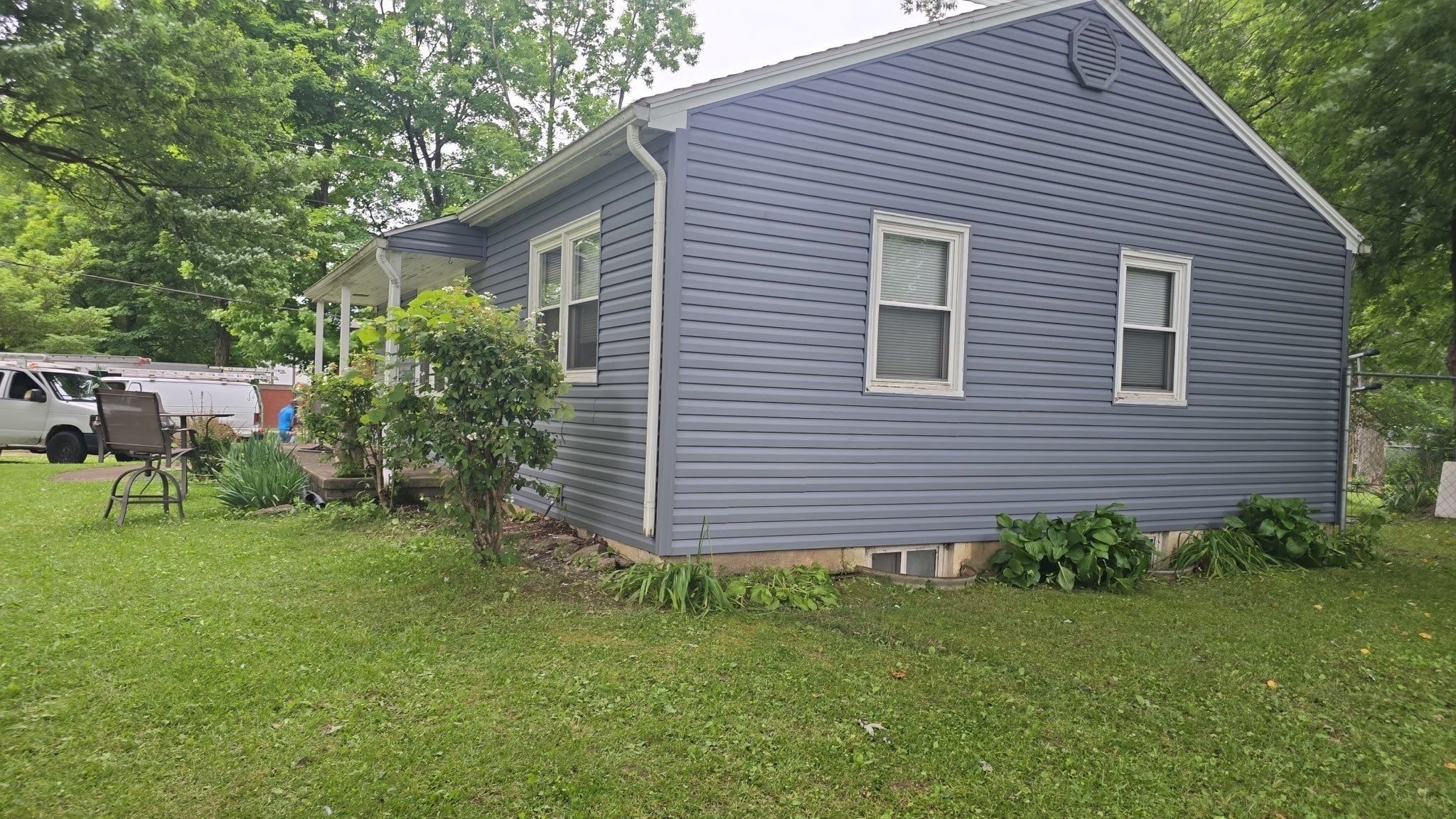 New gray siding on the end wall