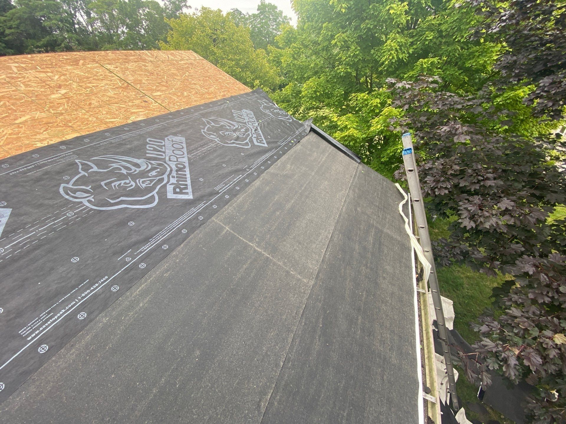 Smooth membrane along the eave with synthetic underlayment above, Yellow Springs, Ohio.