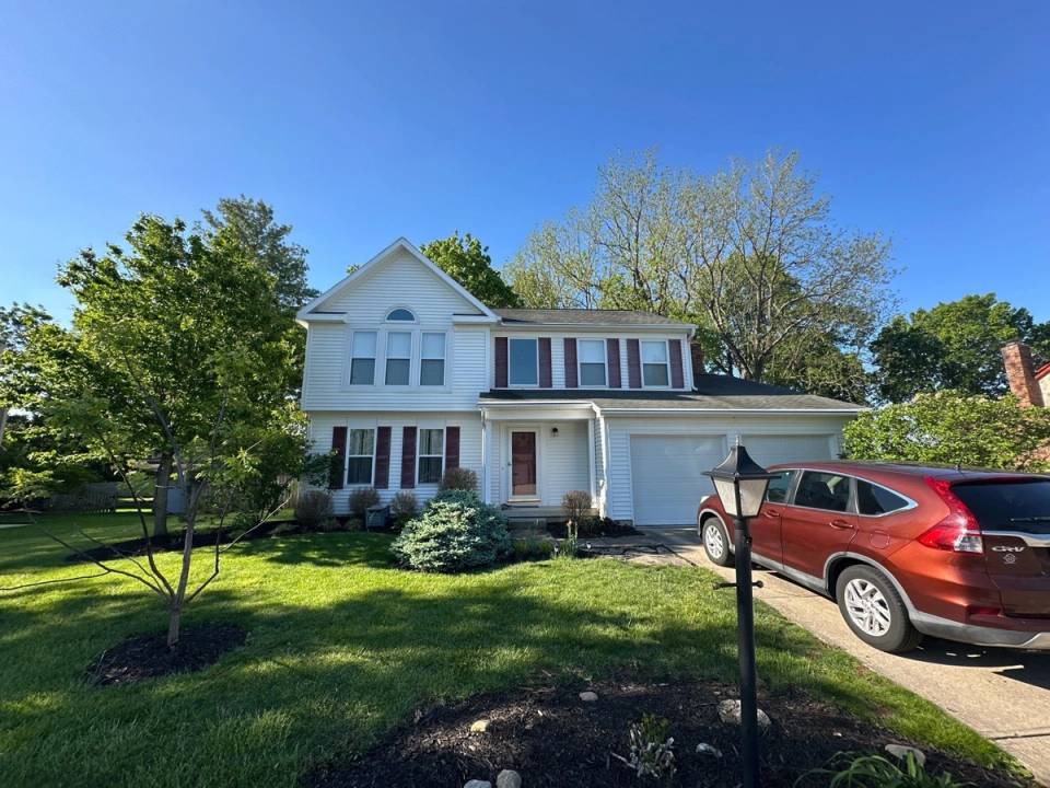 The finished front of the house with new white soffit and trim, Bellbrook, Ohio.