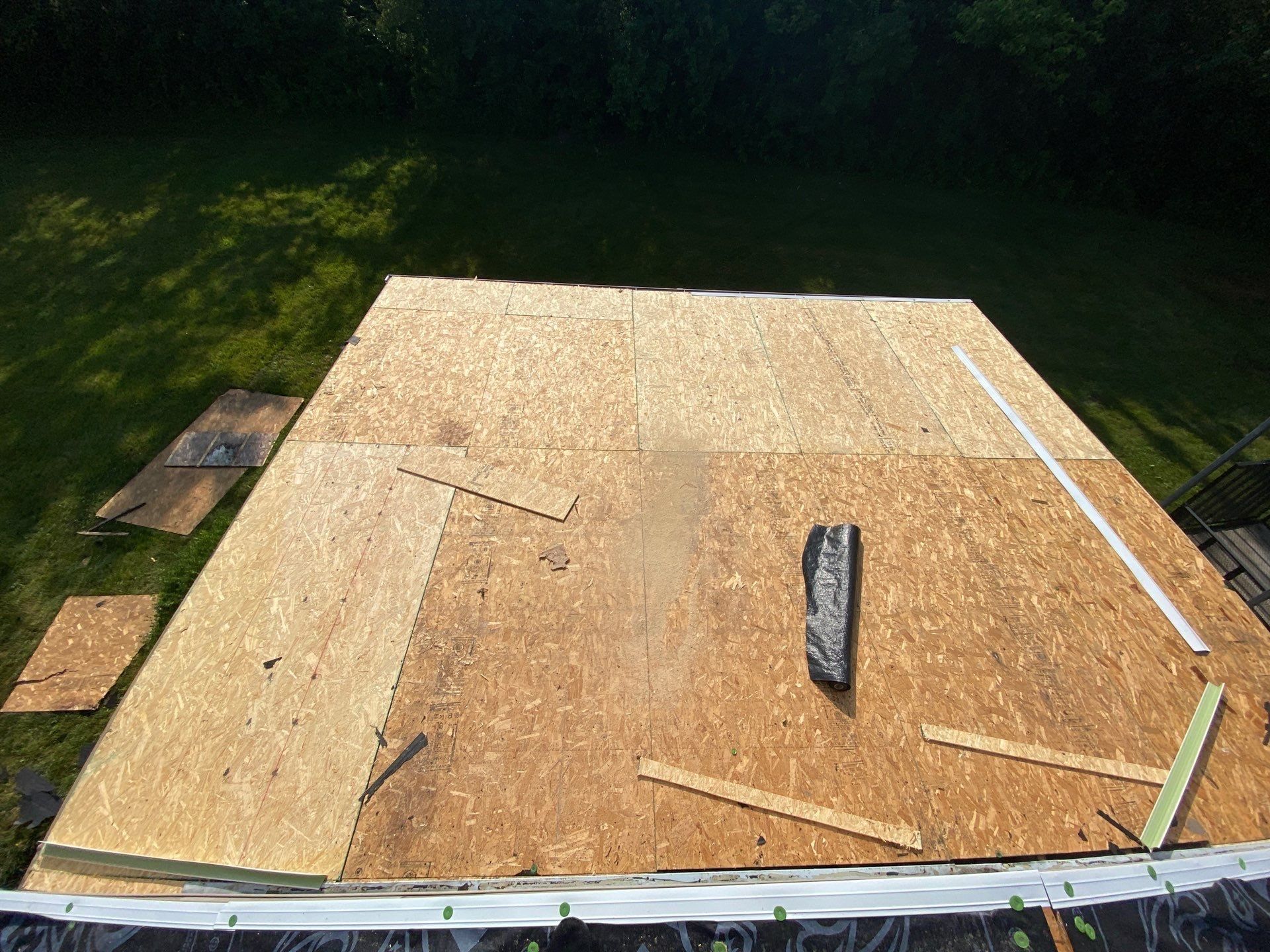 Fresh decking sheets installed on the detached garage roof, Yellow Springs, Ohio.