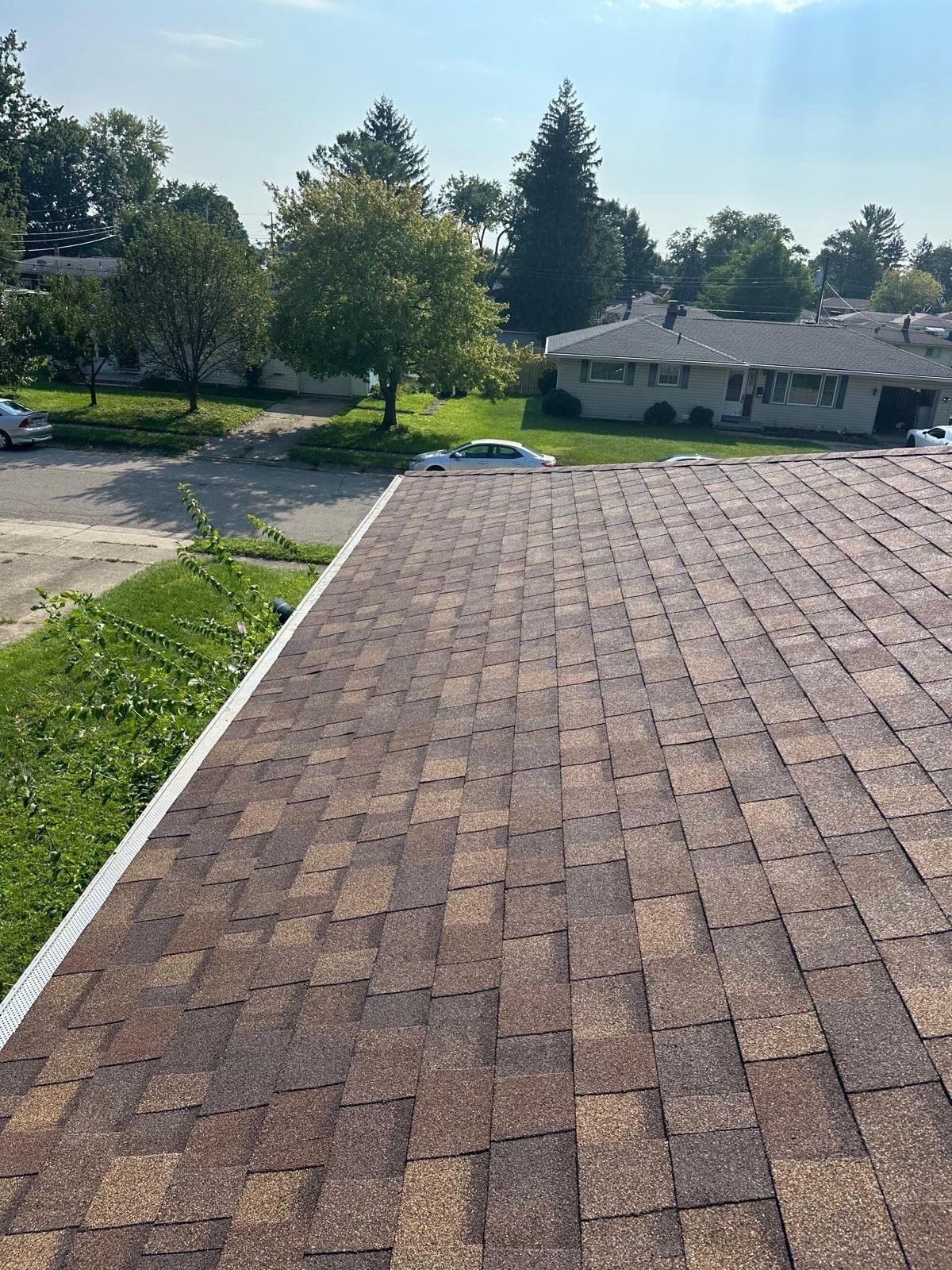 The finished front slope above the street and the houses across it, Fairborn, Ohio.
