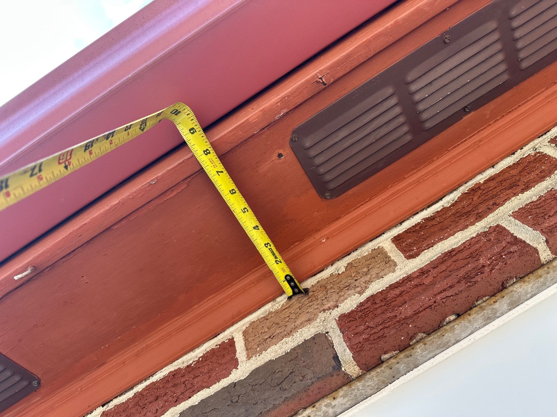 Tape along the siding under the eave