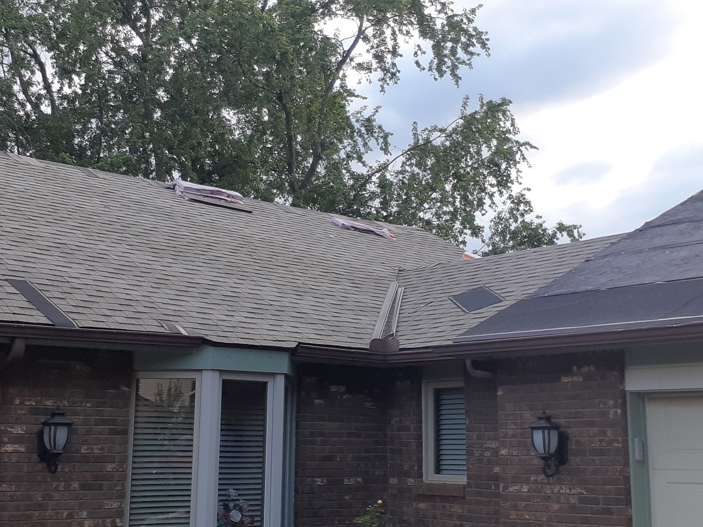 Front entry roof shingled where it meets the garage section, Jamestown, Ohio.