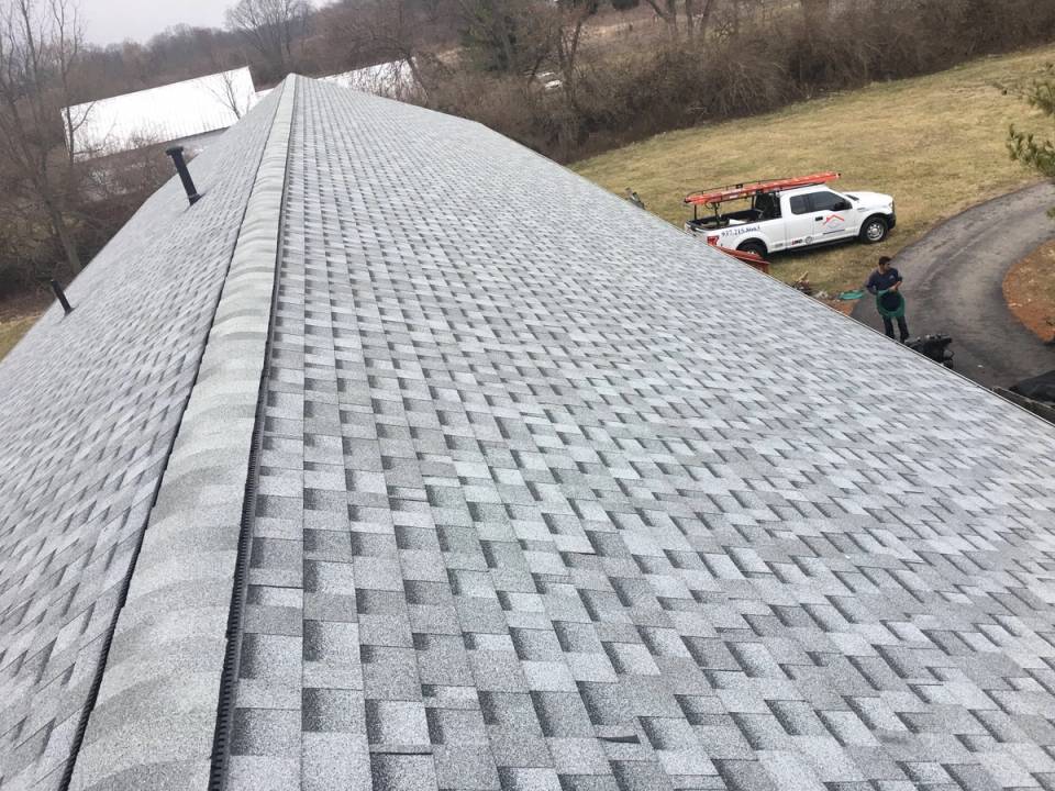 The finished church roof and ridge vent, with the field beyond, Fairborn, Ohio.