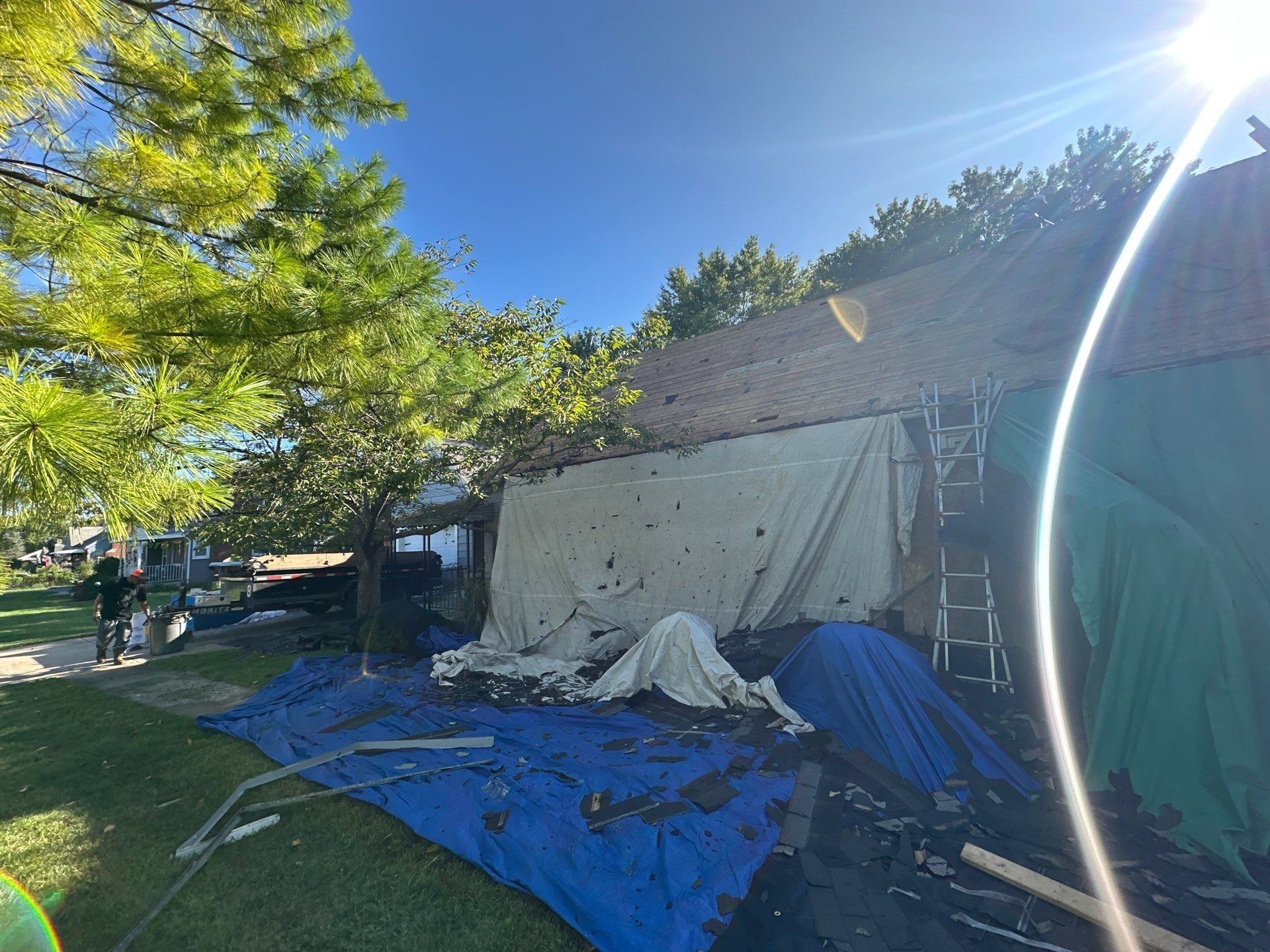Tarps hung on the wall and spread over the yard, Beavercreek, Ohio.