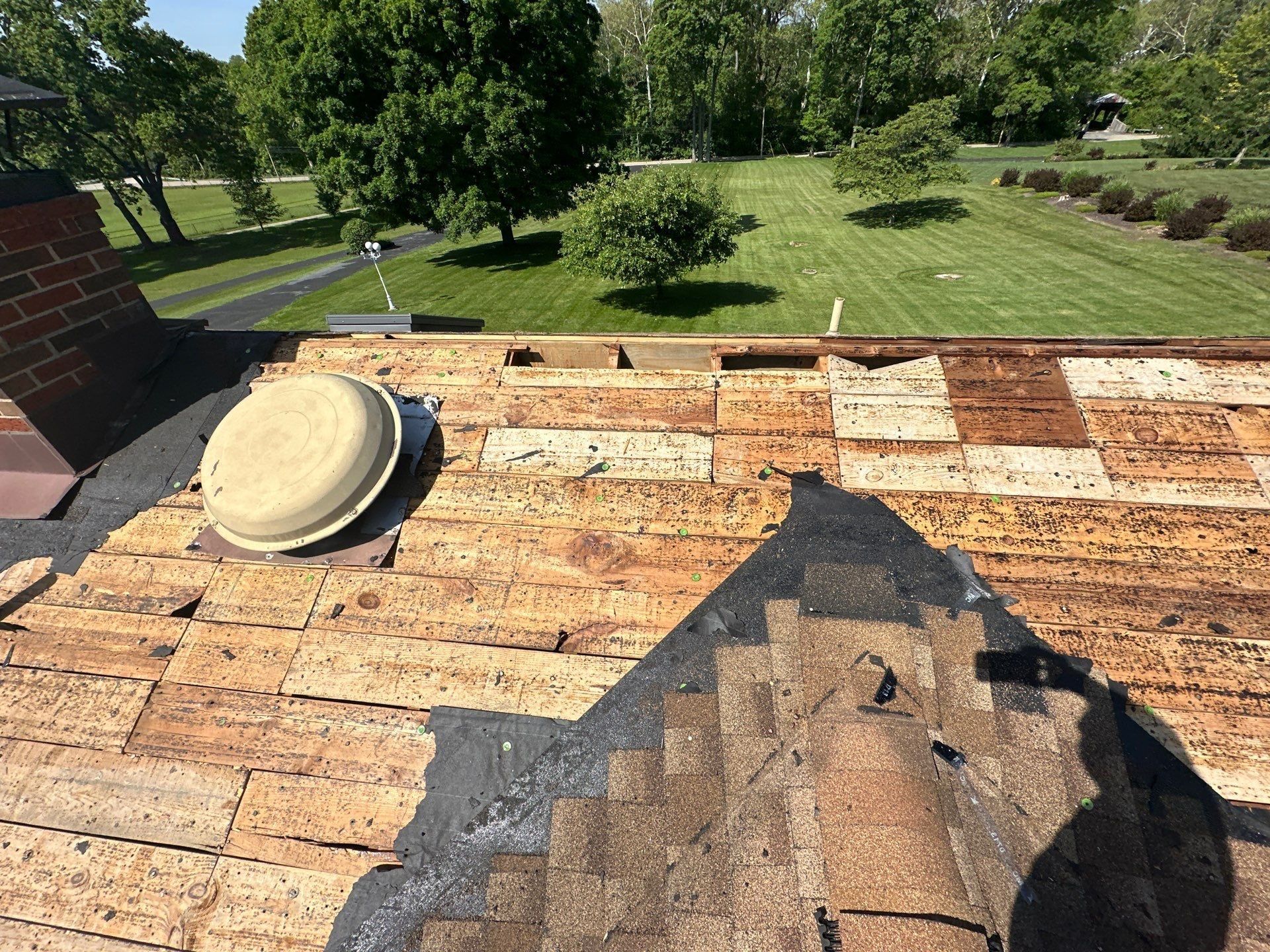 Plank decking around a roof vent