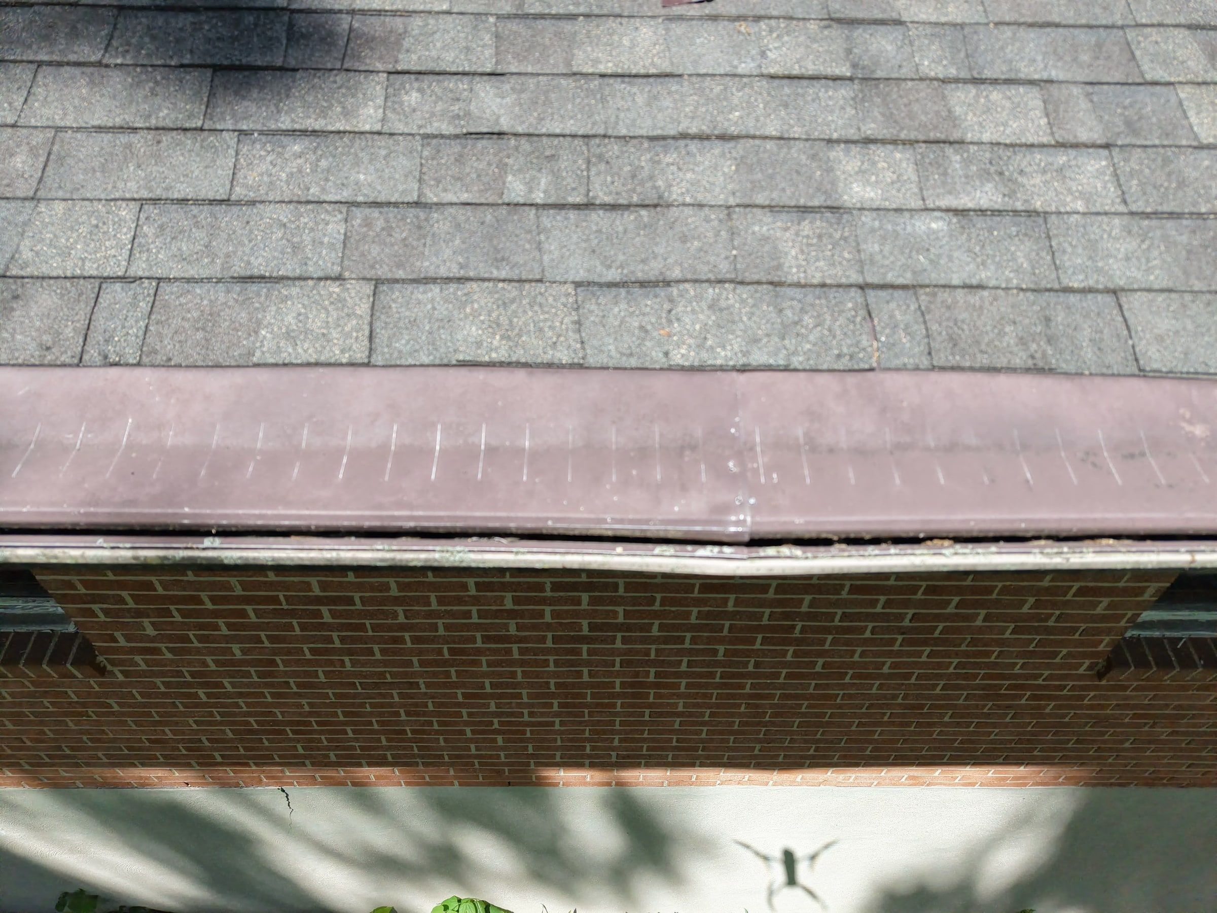 The bent drip edge and roof edge above the old gutter, Beavercreek, Ohio.