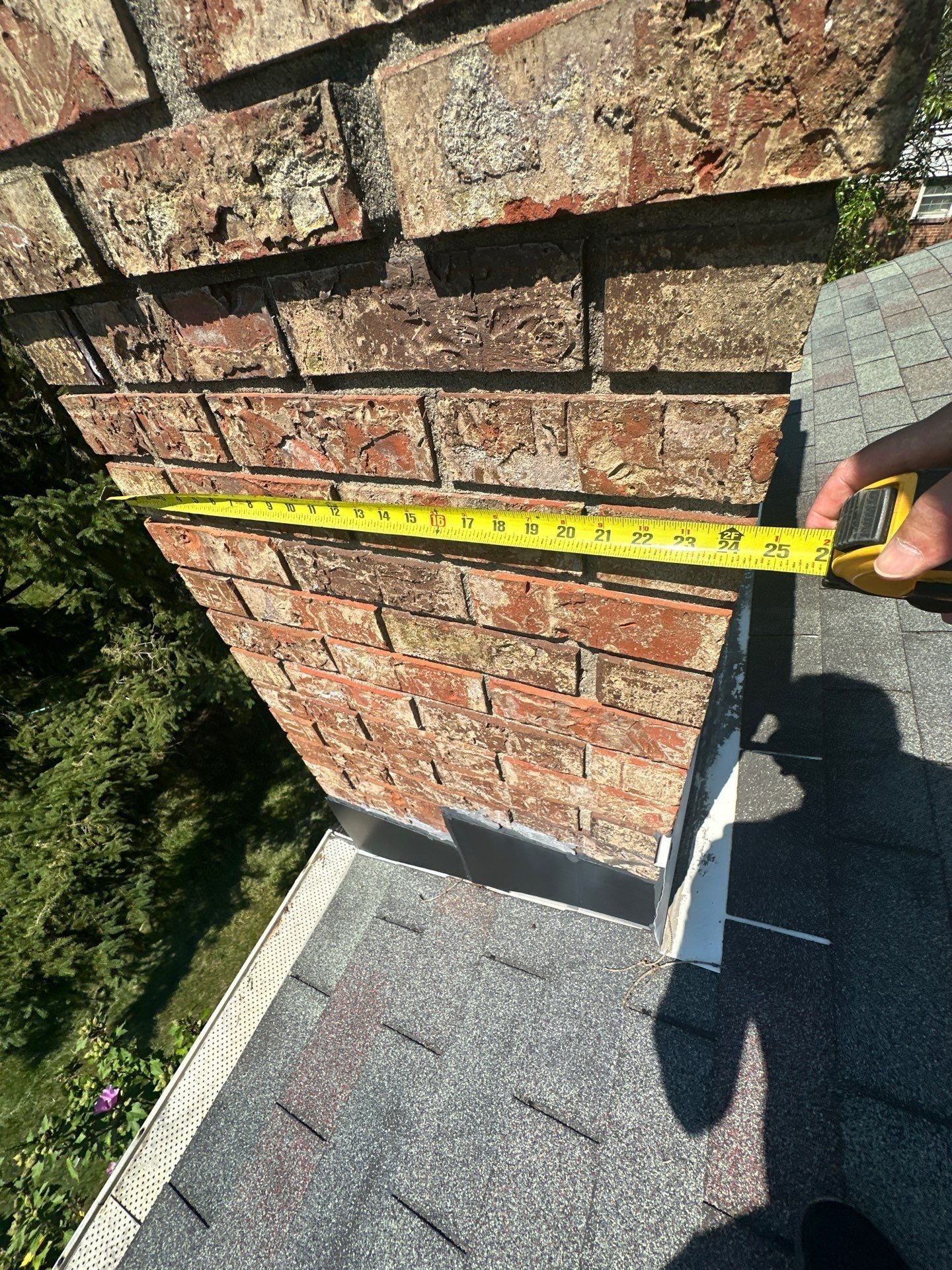 A tape measure across the face of the brick chimney, West Carrollton, Ohio.