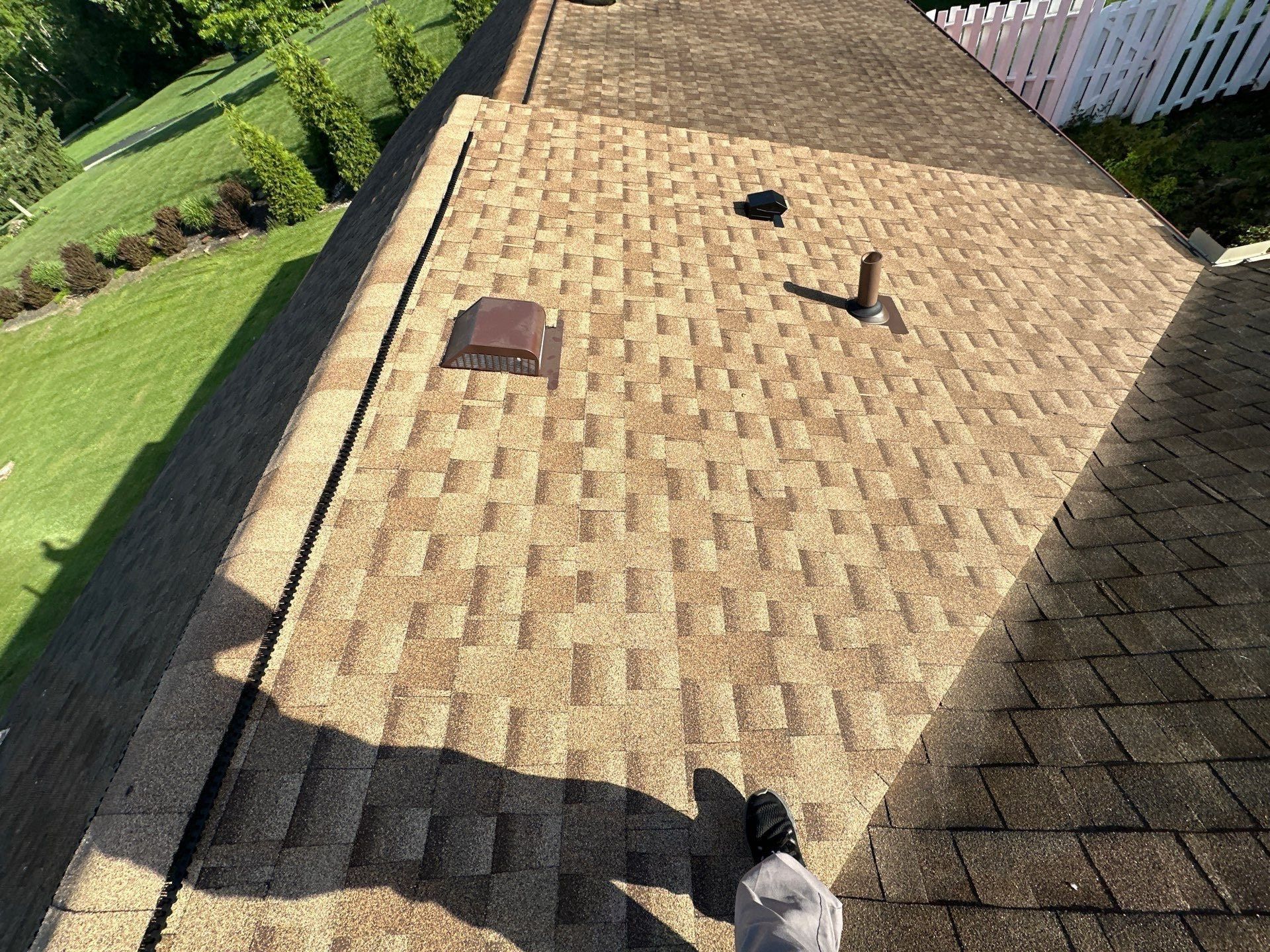 New shingles and roof vents on the repaired back slope, Clayton, Ohio.