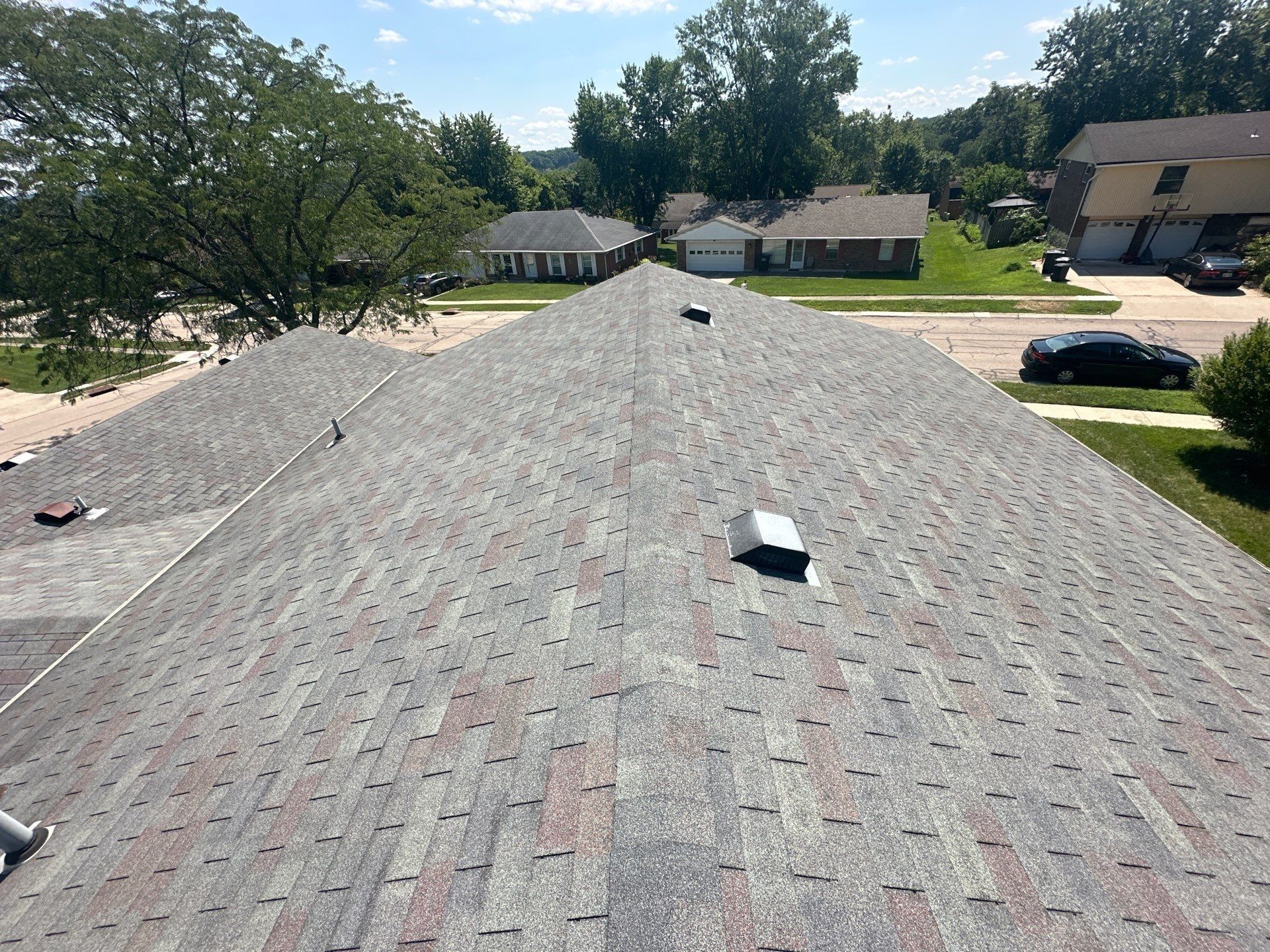 Old shingles running down from the ridge, with a box vent near the top, West Carrollton, Ohio.