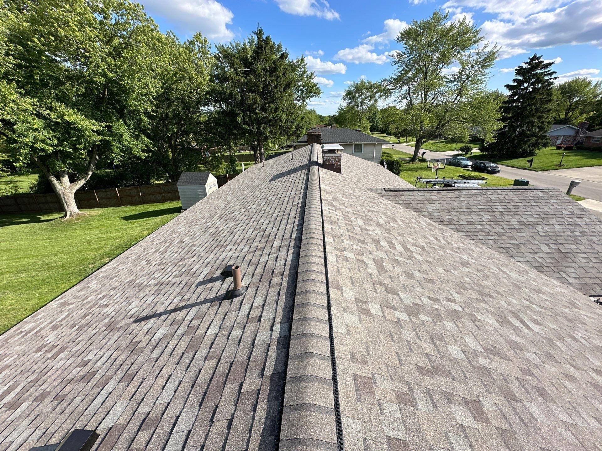 Finished ridge vent and a vent pipe on the back slope, Beavercreek, Ohio.