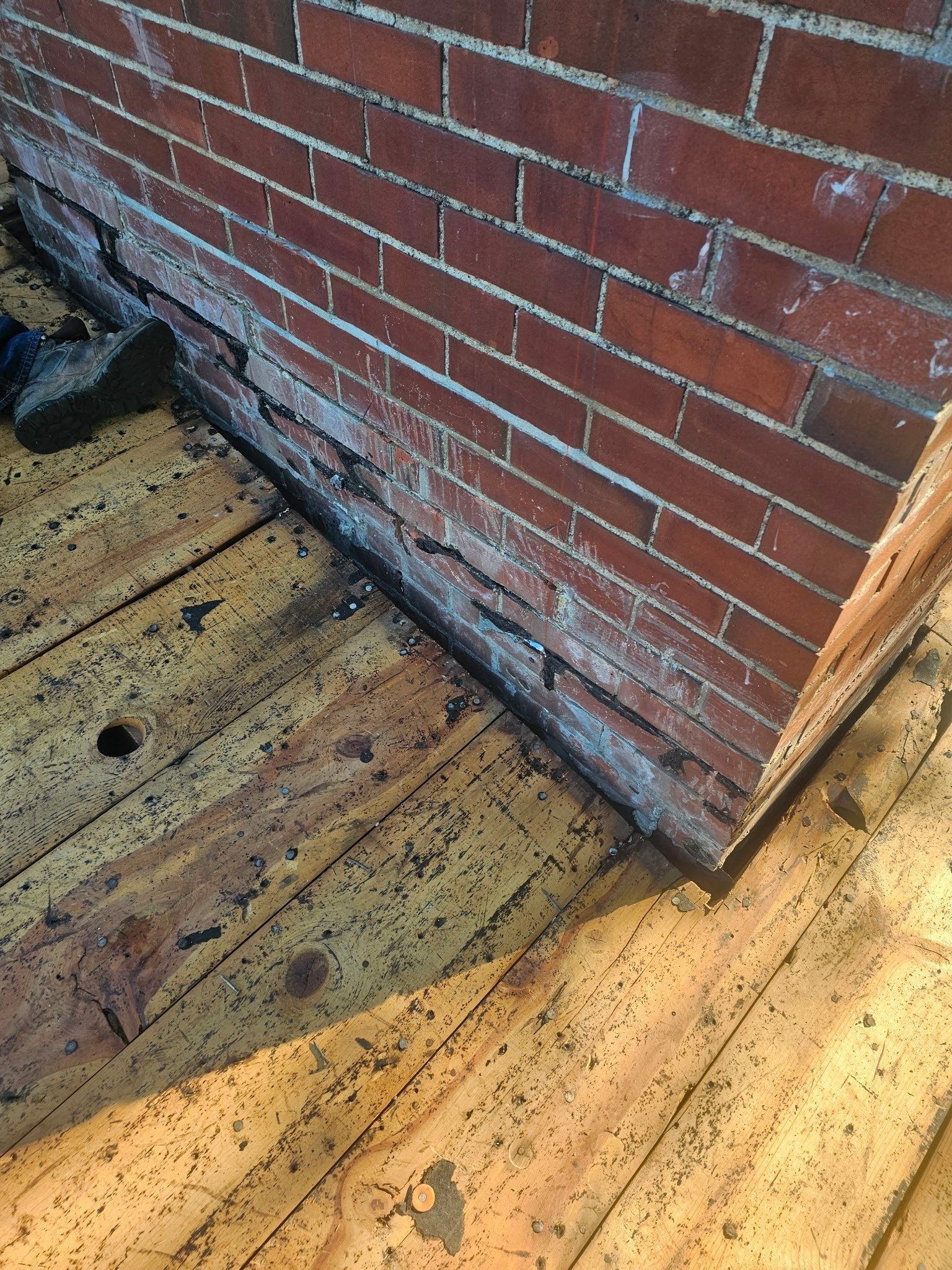 Crumbling mortar at the base of the brick chimney, Kettering, Ohio.