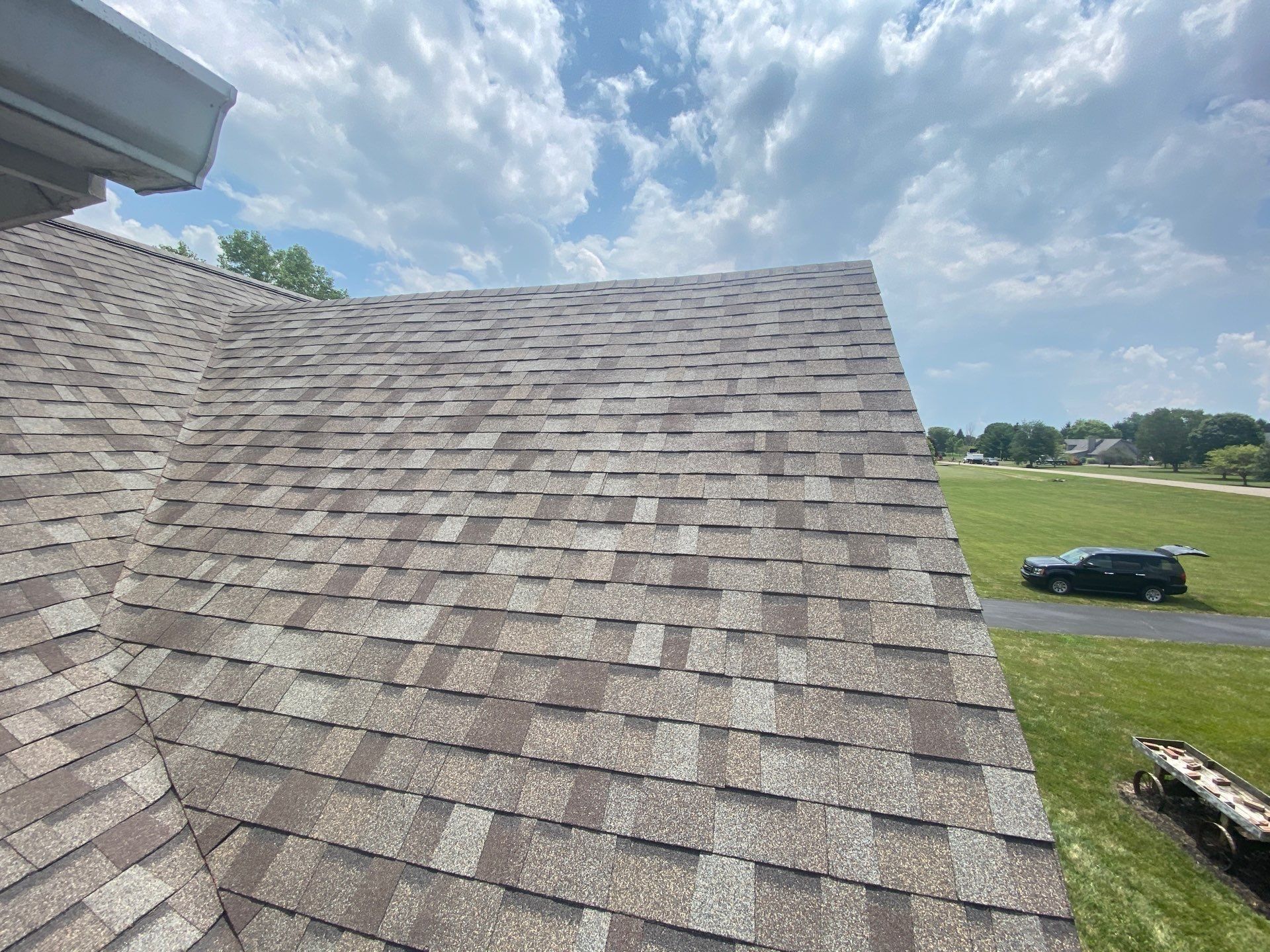 New shingles where the lower roof wraps around the house corner, Yellow Springs, Ohio.