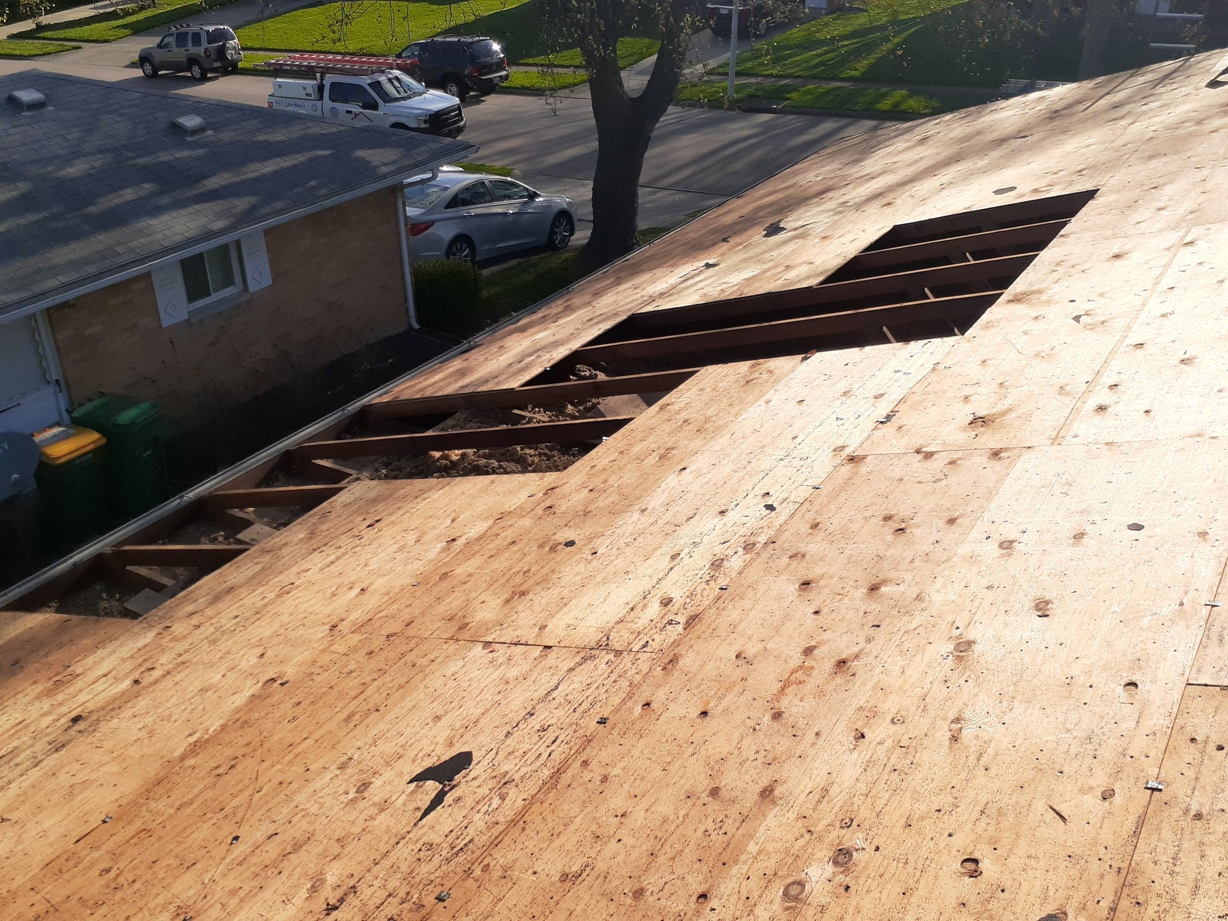 A cut-out section of deck open down to the rafters above the street, Kettering, Ohio.