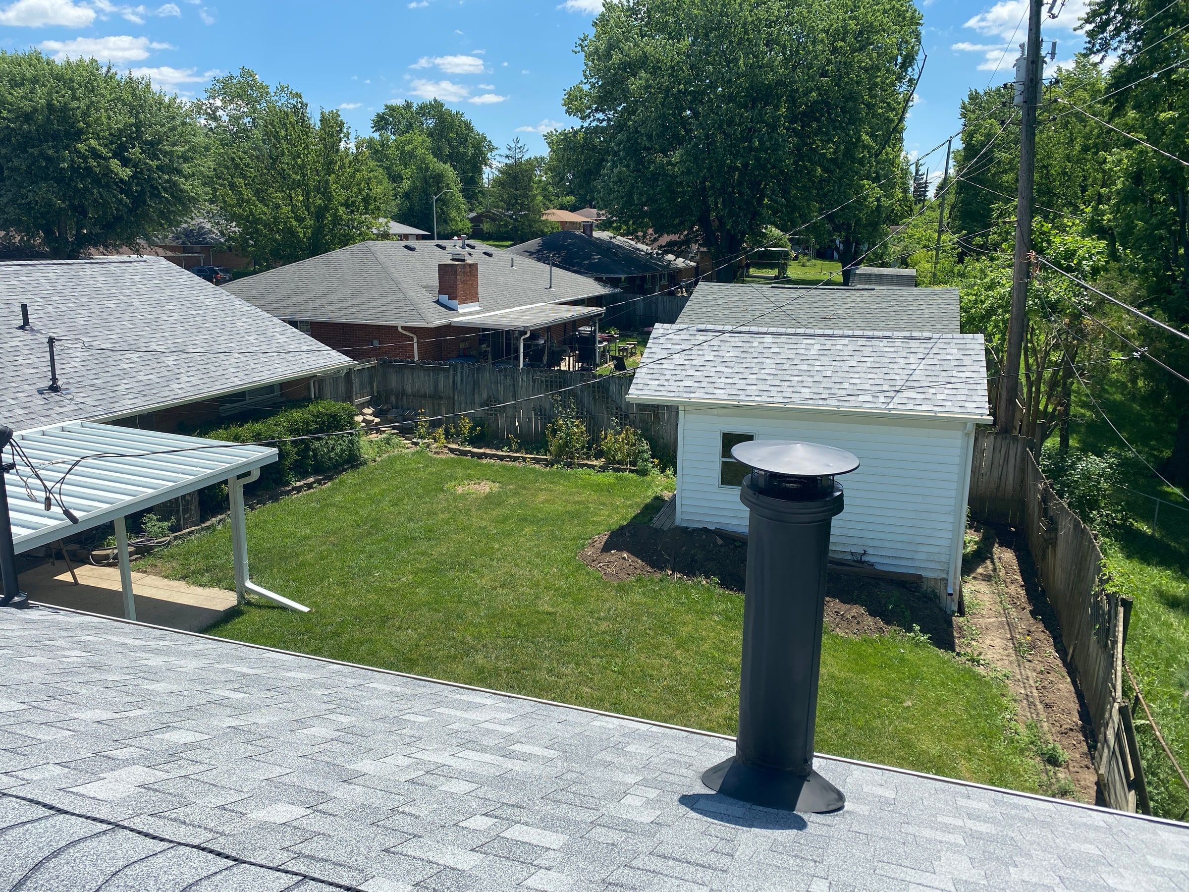 The finished roof and the garage seen from the ridge on a sunny day, Huber Heights, Ohio.