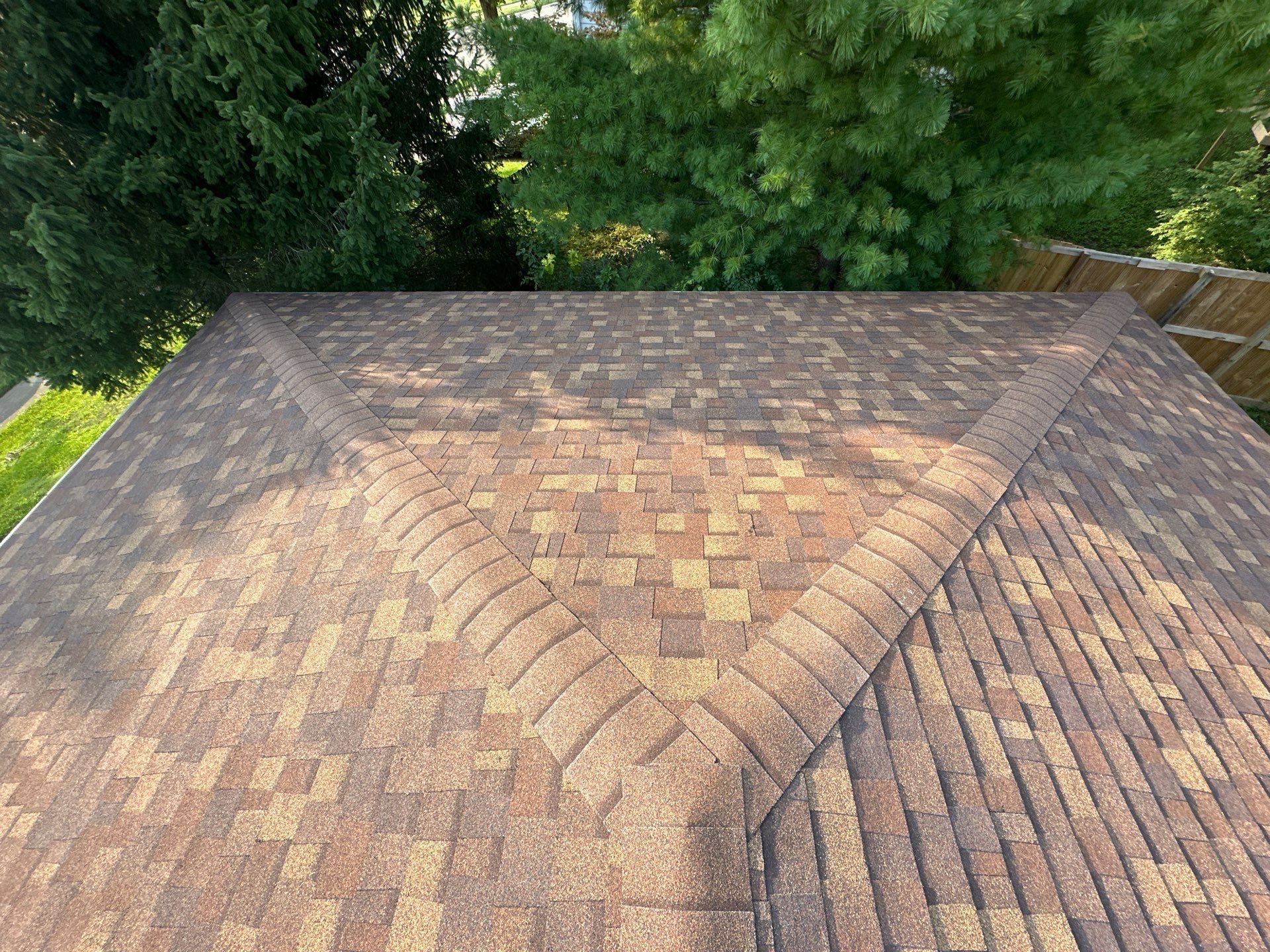 The finished hip end of the roof with the trees behind, Fairborn, Ohio.