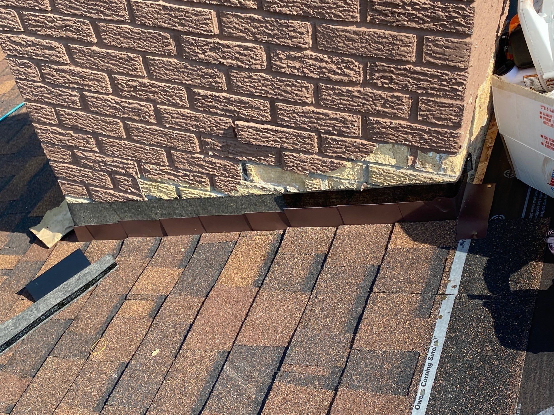 Metal flashing installed along the base of the brick chimney, Beavercreek, Ohio.