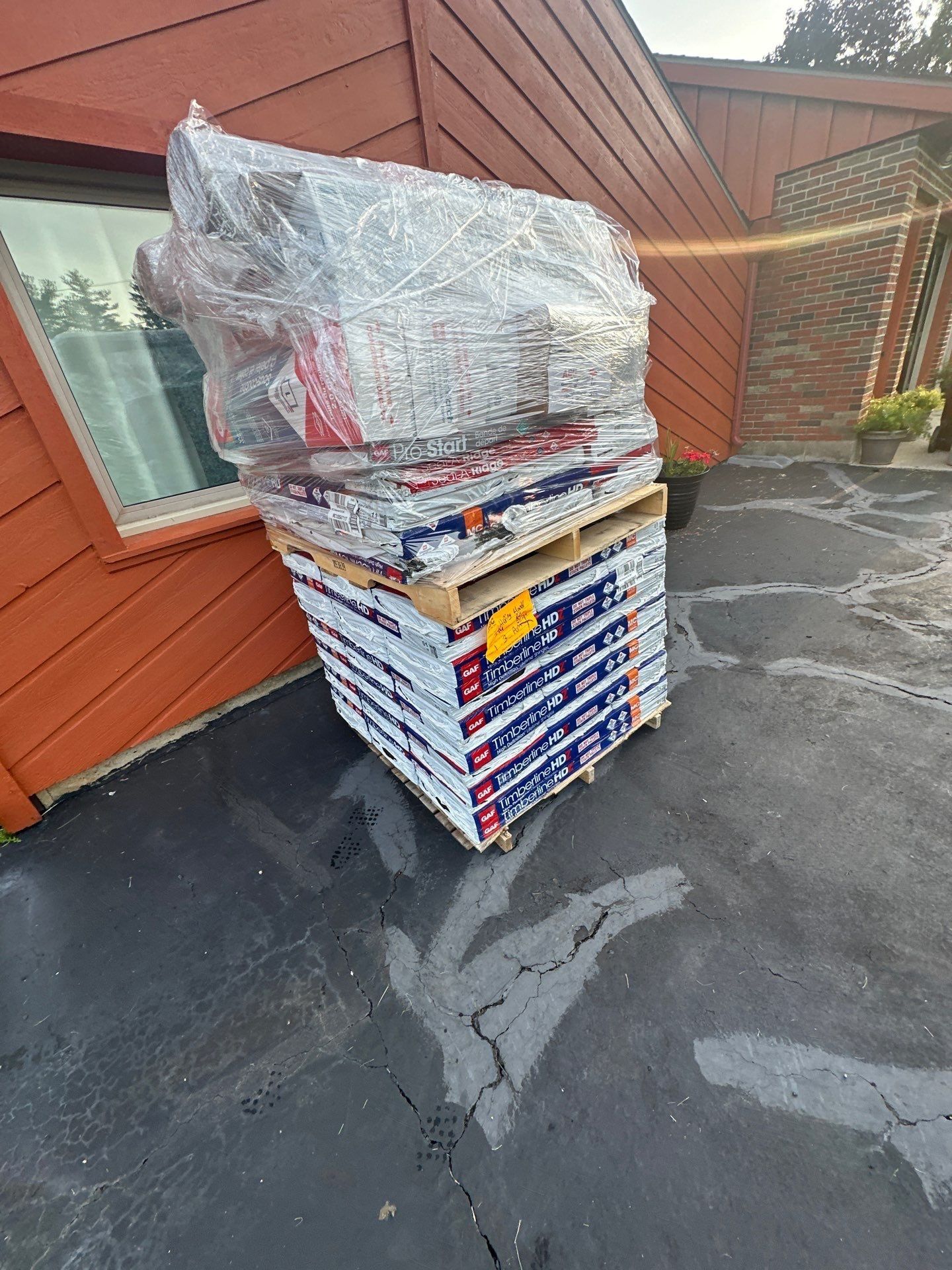 Wrapped pallet of shingles by the drive