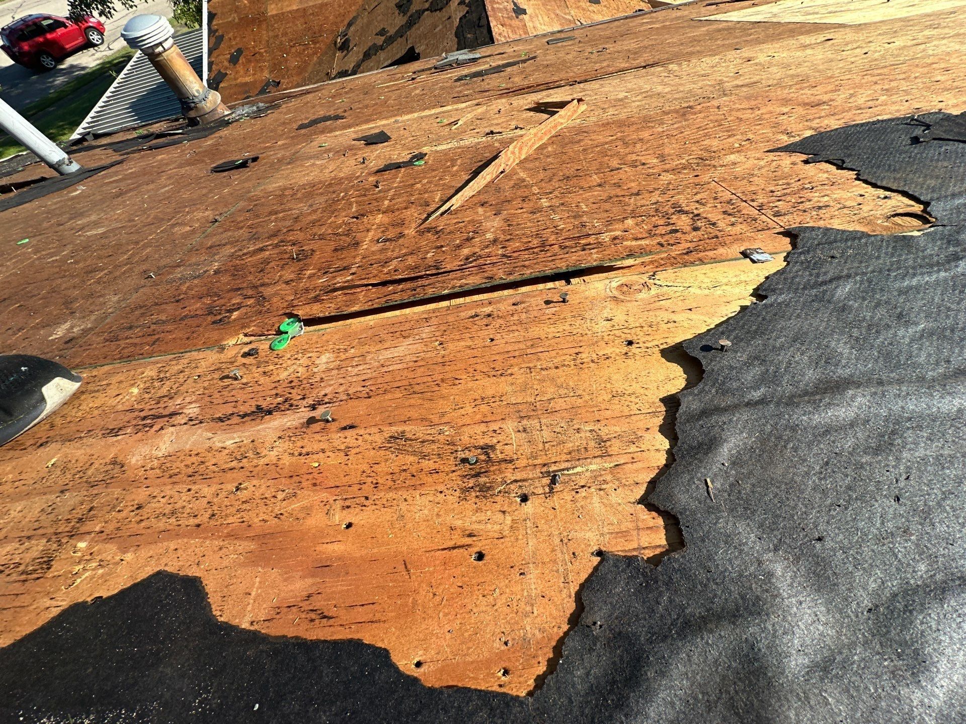 Old plywood deck peeling apart in layers, West Carrollton, Ohio.