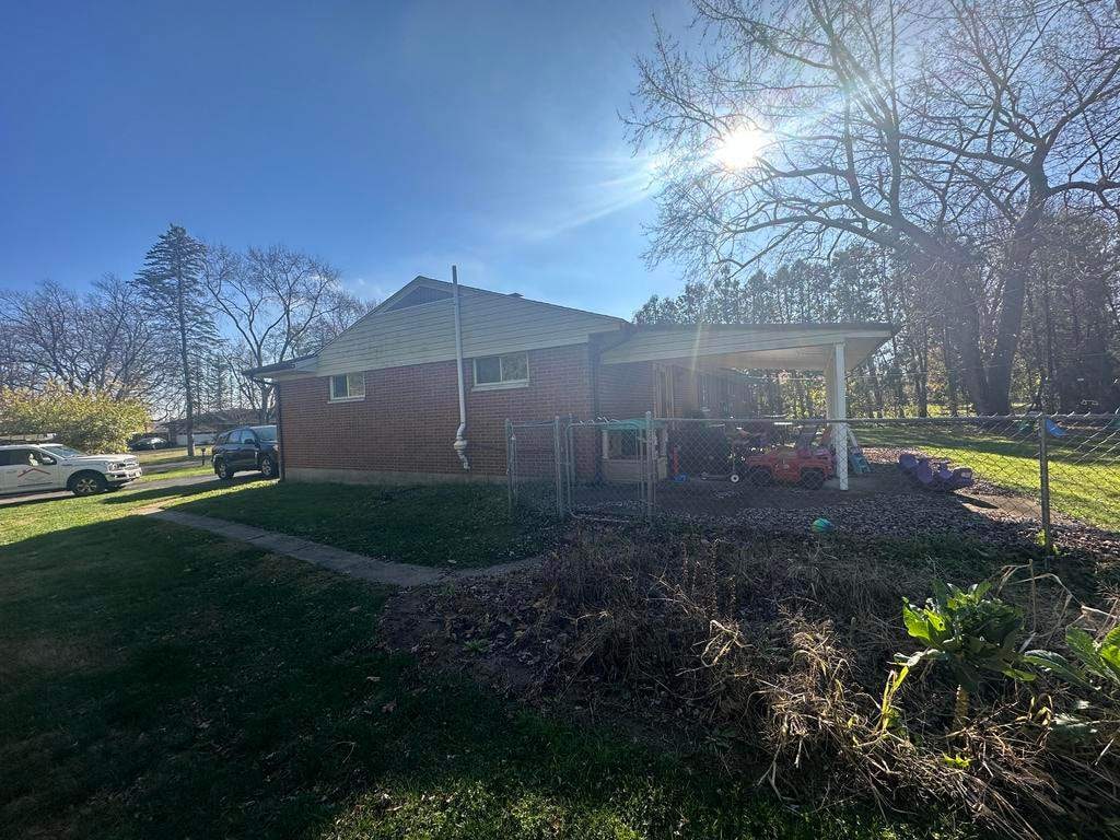 Brick ranch and side carport
