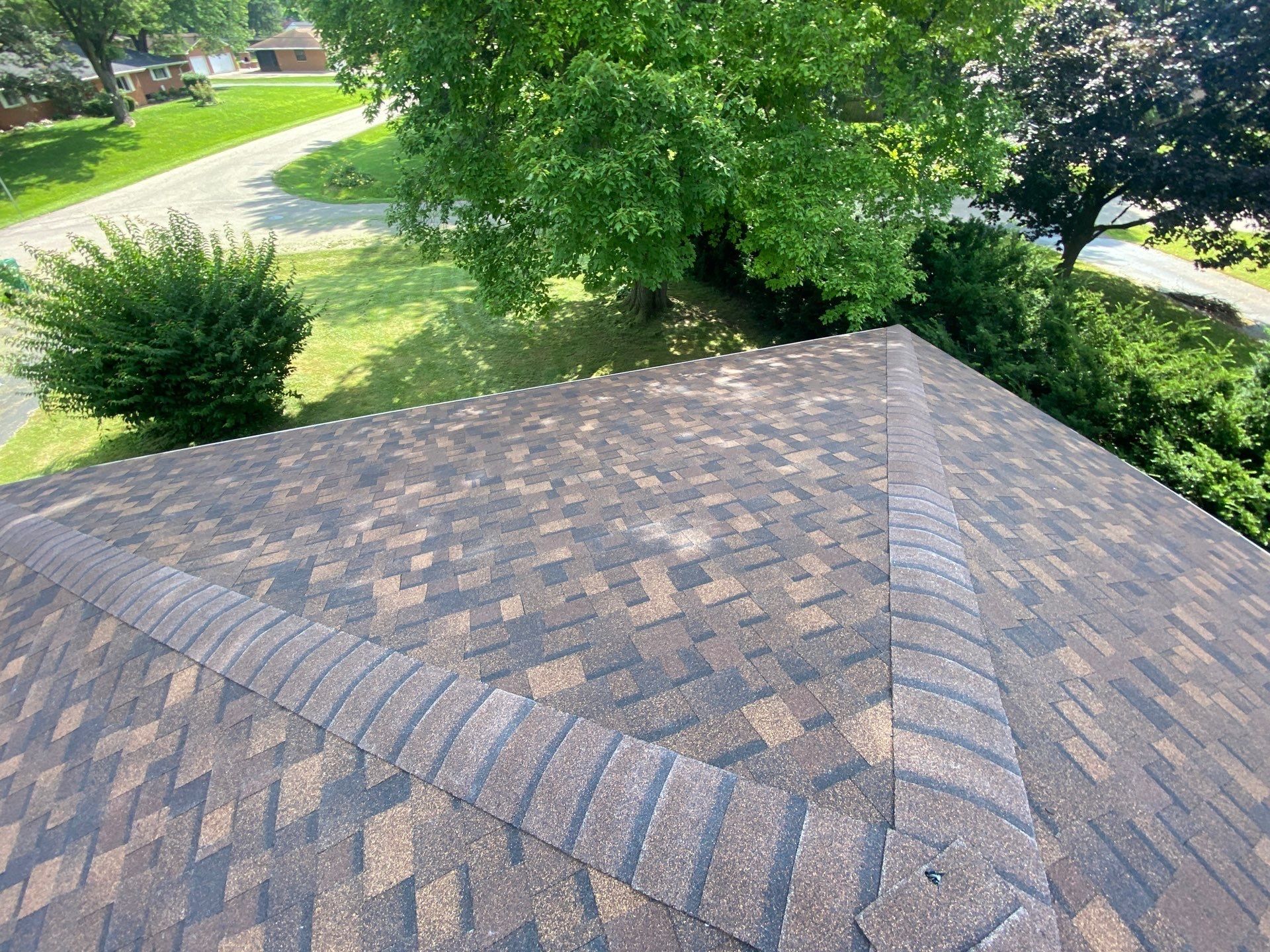 Finished hip roof with new architectural shingles and hip caps, Beavercreek, Ohio.
