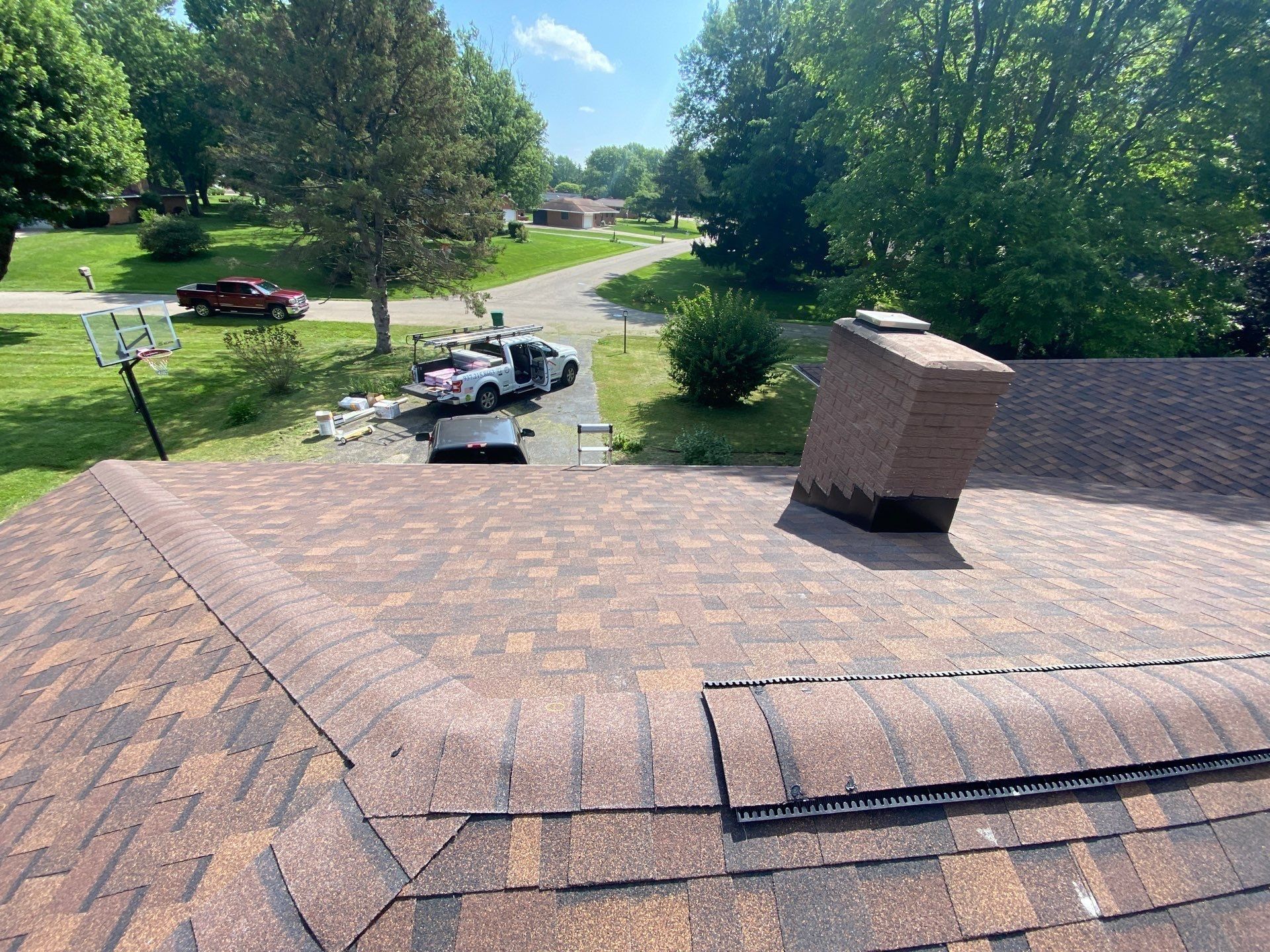 Finished roof with ridge vent and brick chimney on the final day, Beavercreek, Ohio.