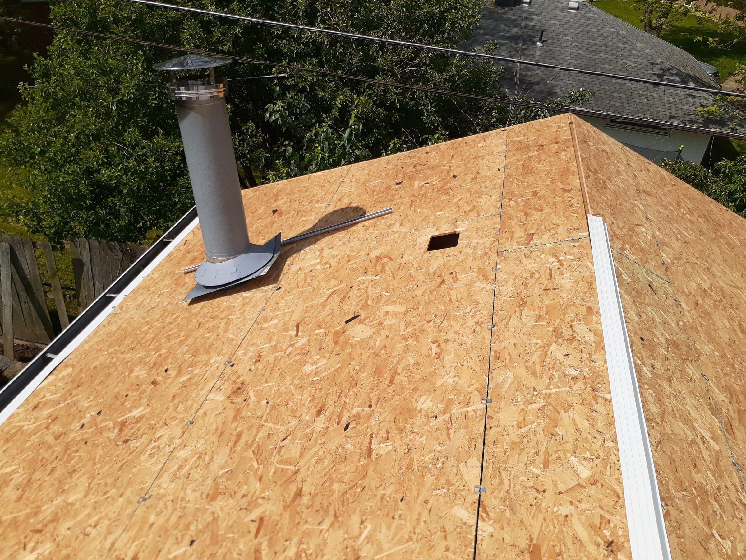The garage roof in new OSB with drip edge along the hip, Huber Heights, Ohio.