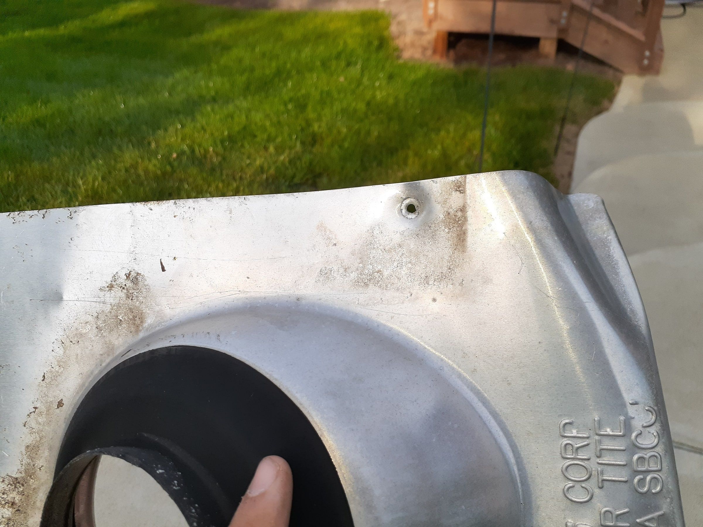 Pipe flashing and rubber collar on concrete