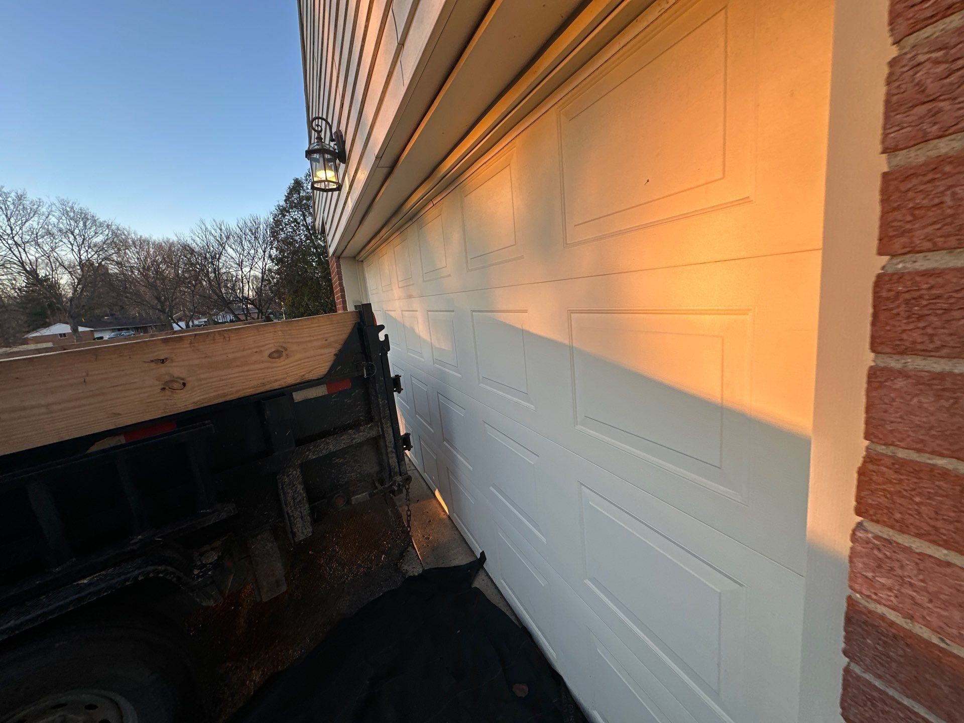 Garage door, trailer and tarp edge
