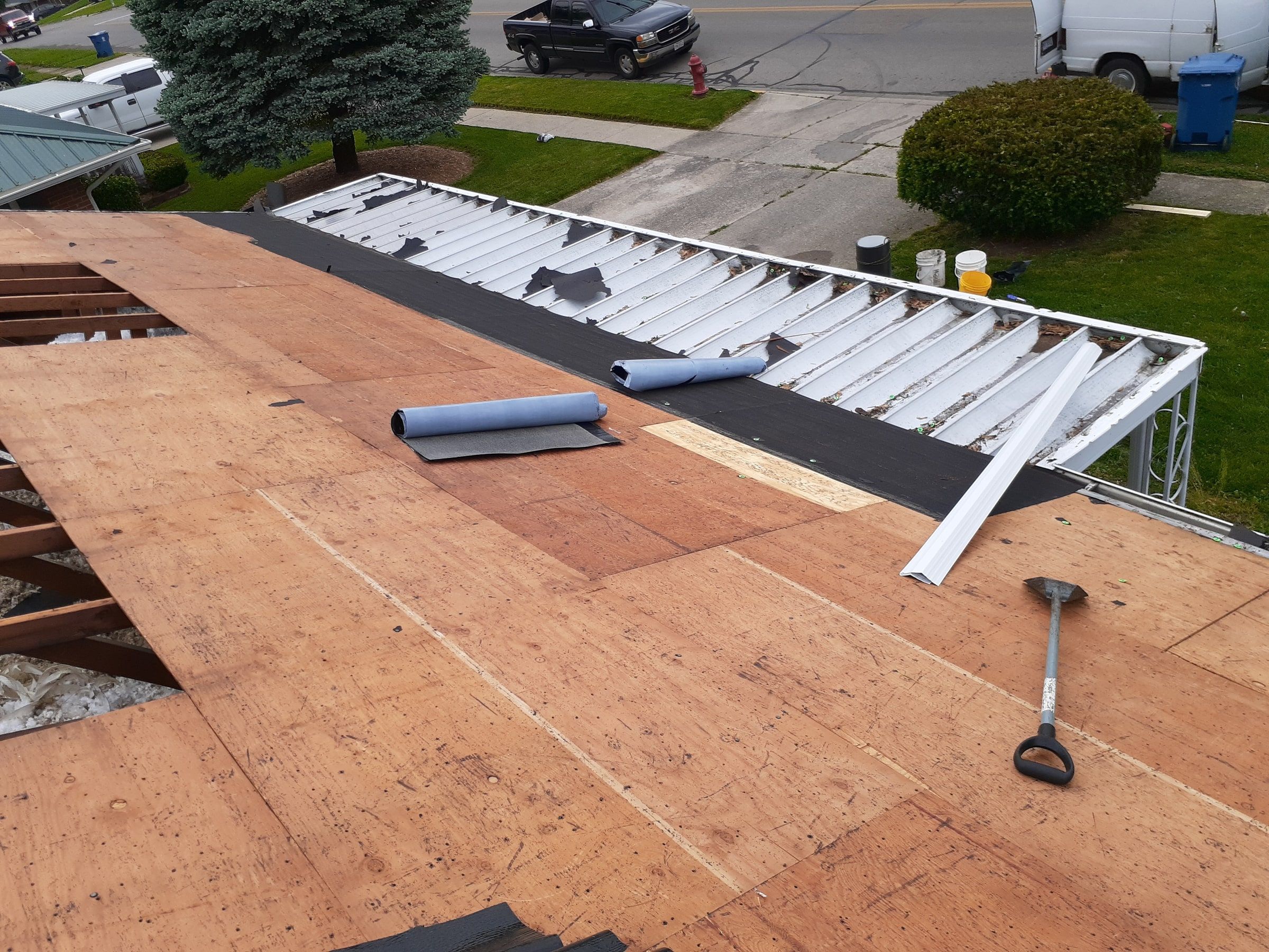 A section of old deck cut out down to the rafters above the porch roof, Huber Heights, Ohio.