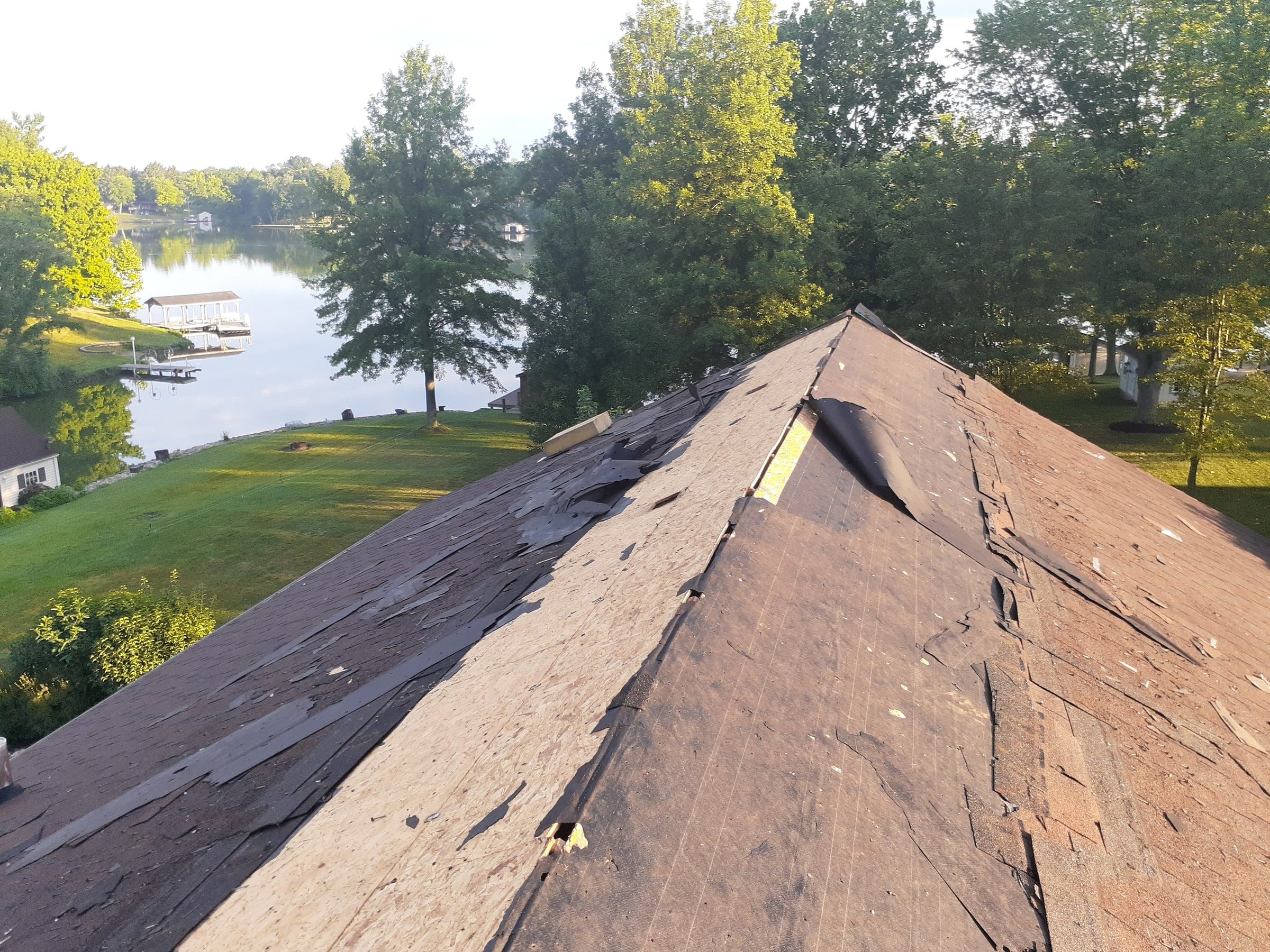 Hip of the roof with the old shingles being stripped away, Jamestown, Ohio.