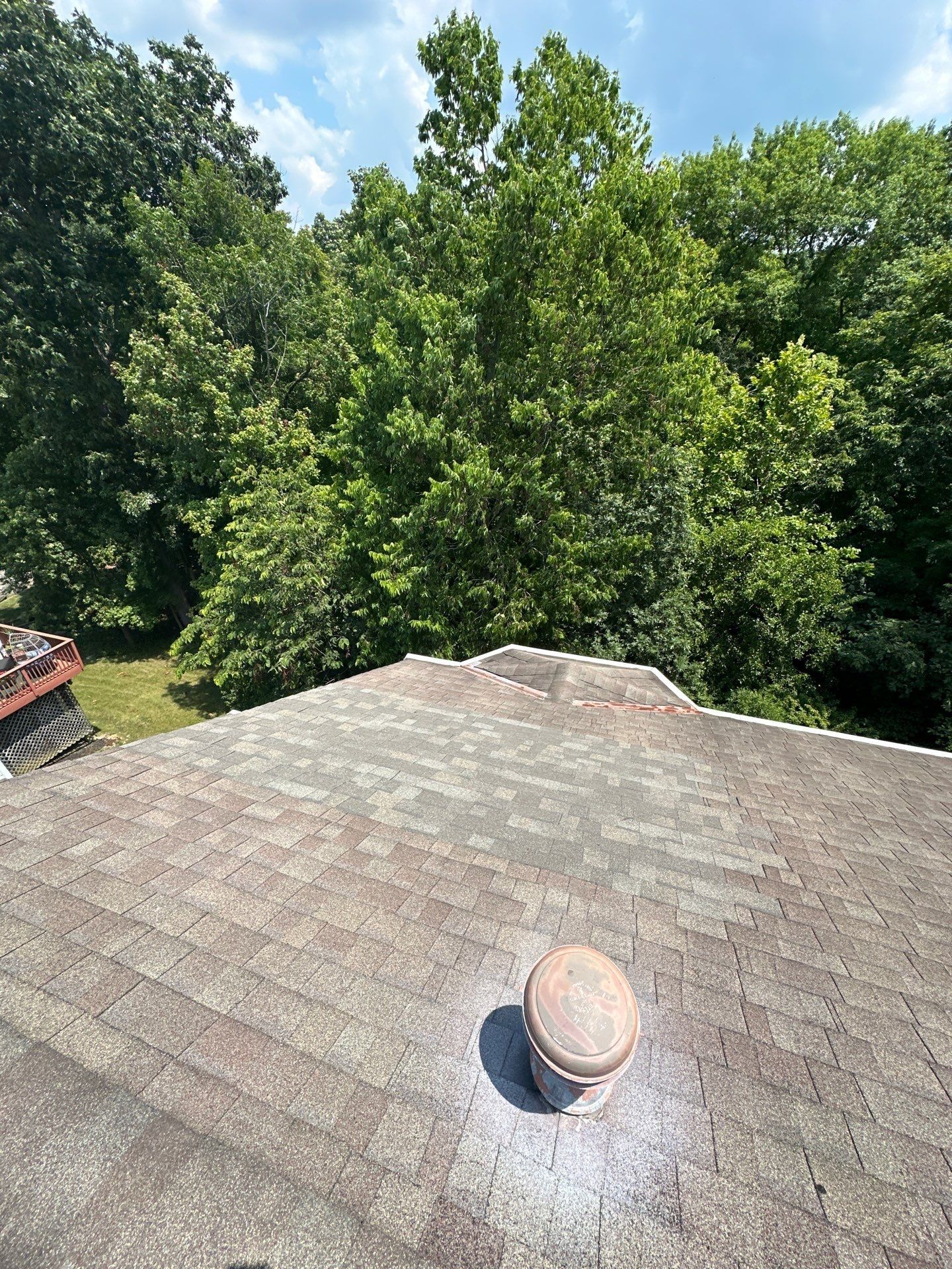 Shingle repair patch near the ridge