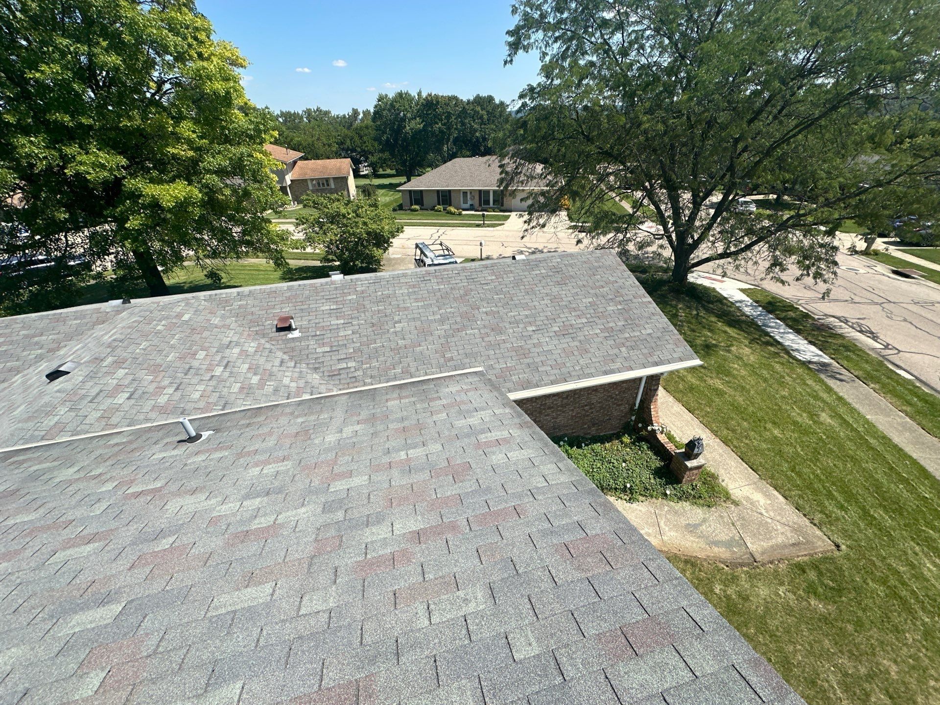 The old lower roof over the brick wing, with the street beyond, West Carrollton, Ohio.