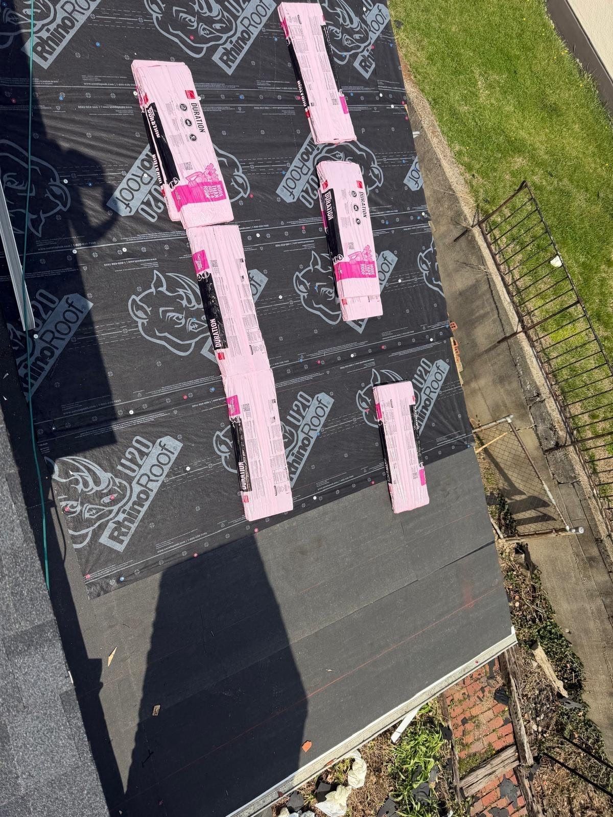 Shingle bundles across the underlayment