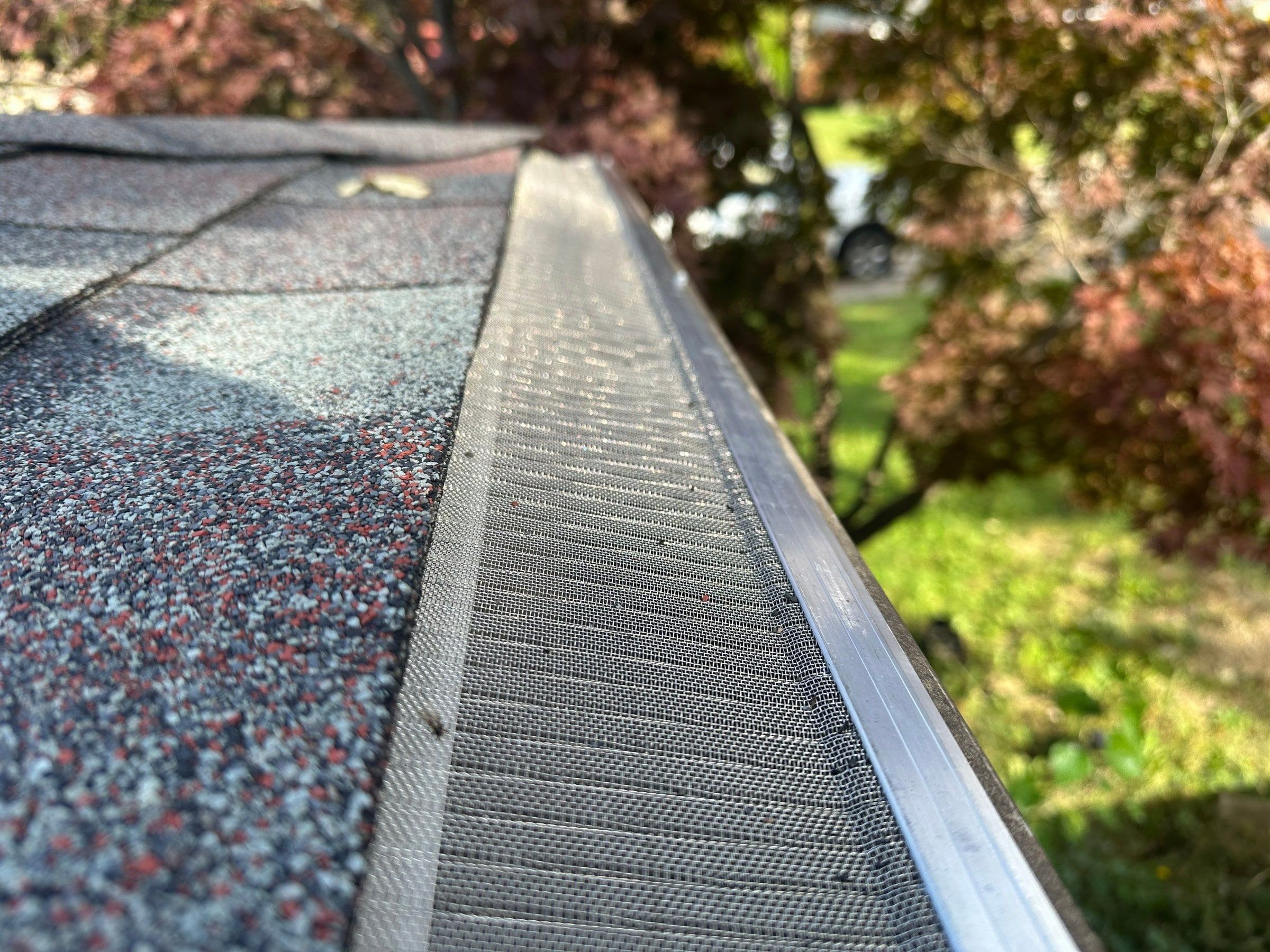 Close view of the mesh gutter guard meeting the shingles on Brubaker Dr, Kettering