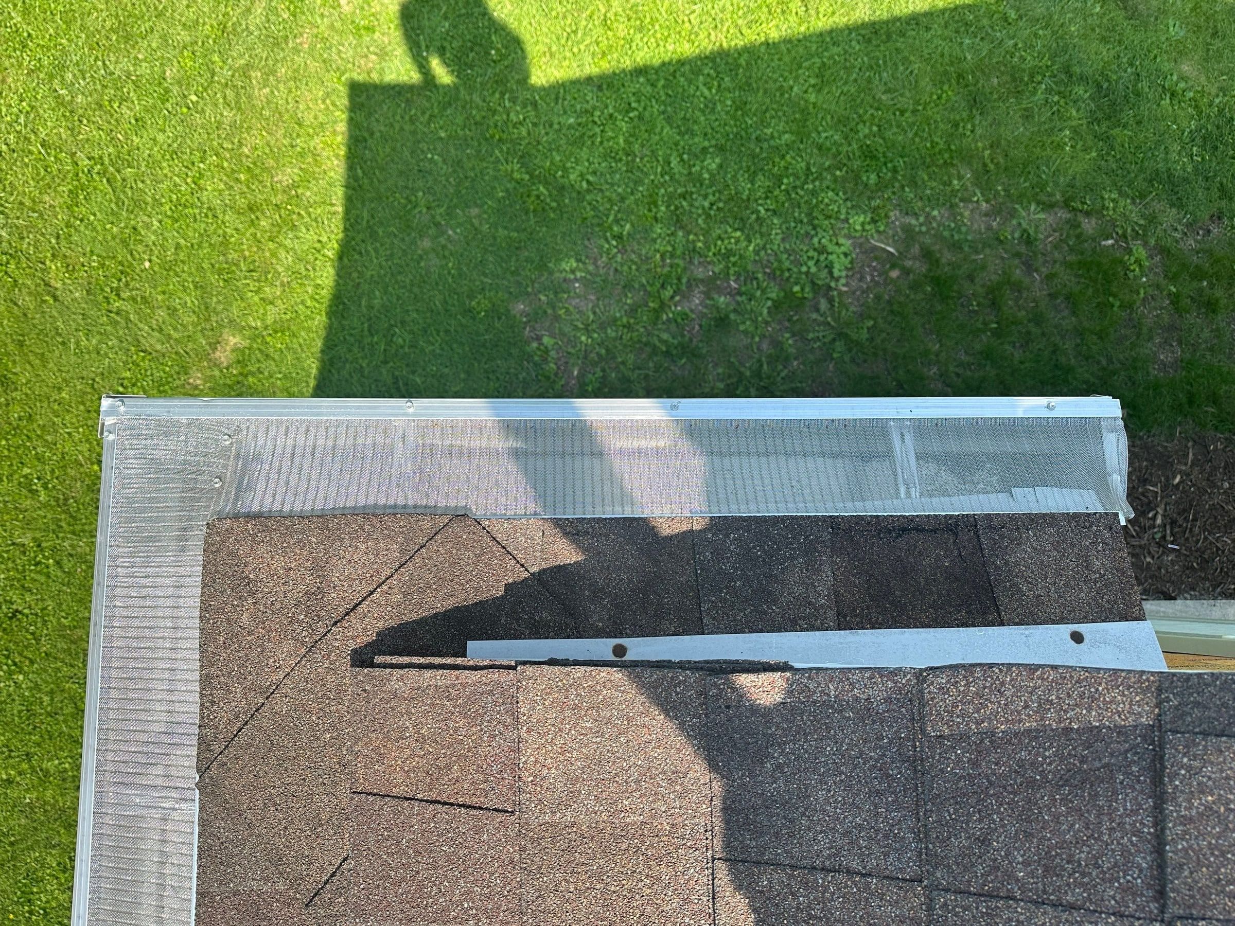 Gutter guard at the roof edge where two rooflines meet, Kettering, Ohio.