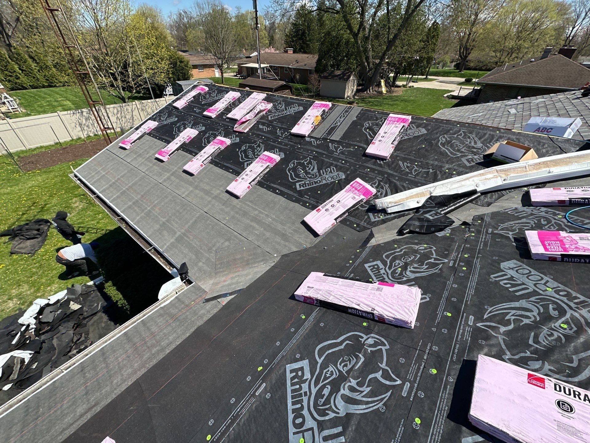 Shingle bundles staged across the whole roof before installation, Beavercreek, Ohio.