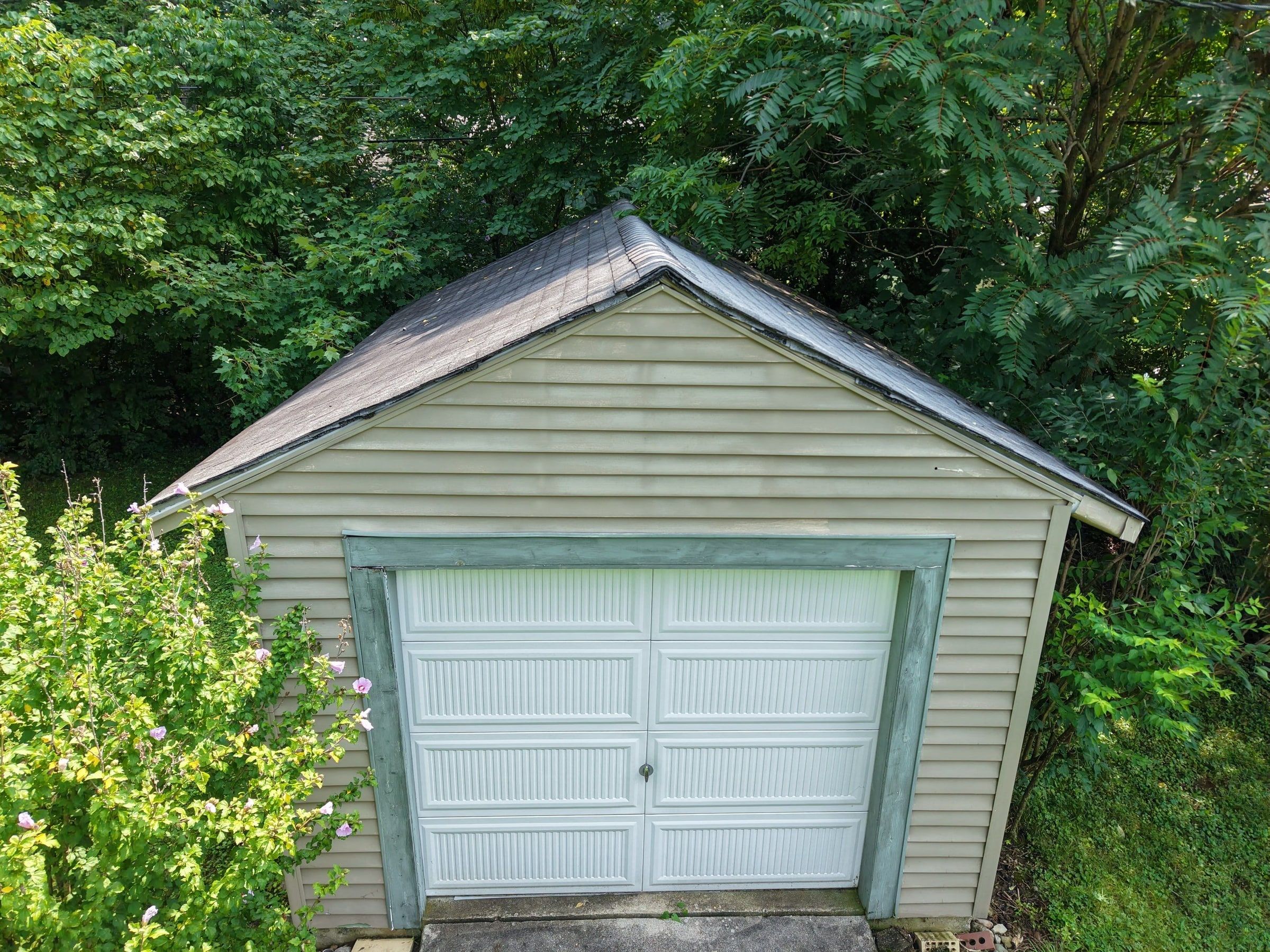 The detached garage from the front, under the trees, Beavercreek, Ohio.